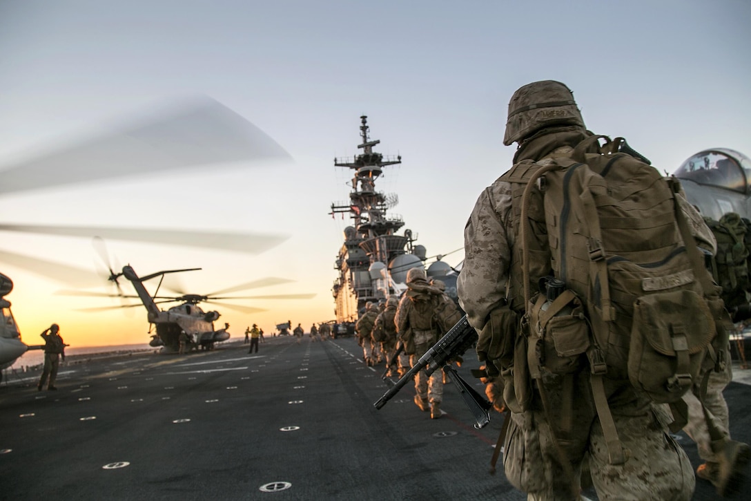 Marines return to the USS Boxer after conducting a raid on a simulated hostile village on Twentynine Palms, Calif., Oct. 30, 2015, during a composite exercise at sea. The Marines are assigned to Battalion Landing Team 2, 1st Battalion, 13th Marine Expeditionary Unit. The exercise enables Marines to integrate naval training while also allowing focused, mission-specific training and evaluation for the Marines and their Navy counterparts. U.S. Marine Corps photo by Cpl. Briauna Birl