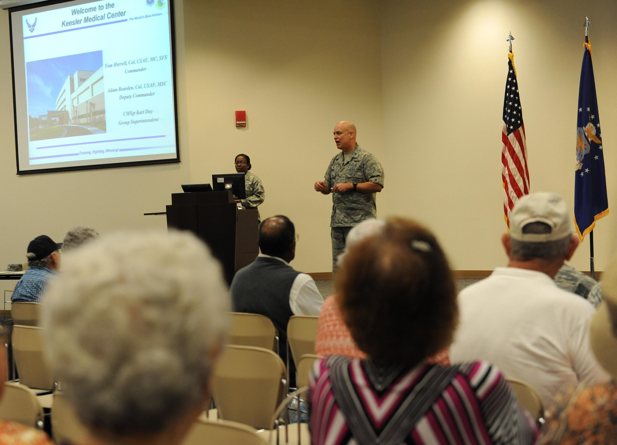 Col. Thomas Harrell, 81st Medical Group commander, briefs retirees on Keesler Medical Center benefits during Retiree Appreciation Day at the Roberts Consolidated Aircraft Maintenance Facility Nov. 6, 2015, Keesler Air Force Base, Miss.  The annual event sponsored by the Keesler Retiree office included more than 20 displays with information pertinent to retirees and a free lunch.  (U.S. Air Force photo by Kemberly Groue)