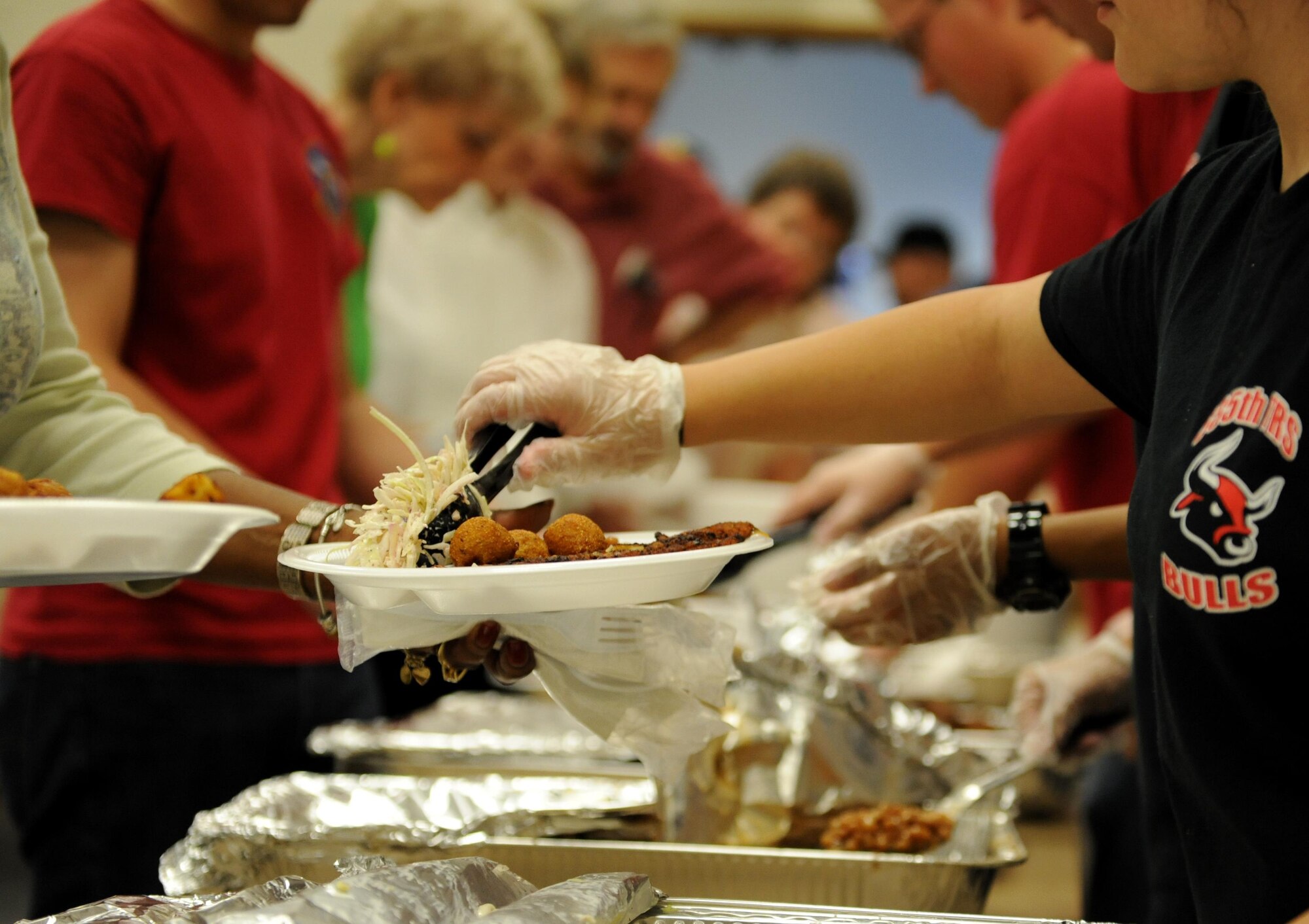 Military retirees are served lunch during Retiree Appreciation Day at the Roberts Consolidated Aircraft Maintenance Facility Nov. 6, 2015, Keesler Air Force Base, Miss.  The annual event sponsored by the Keesler Retiree office included more than 20 displays with information pertinent to retirees and a free lunch.  (U.S. Air Force photo by Kemberly Groue)