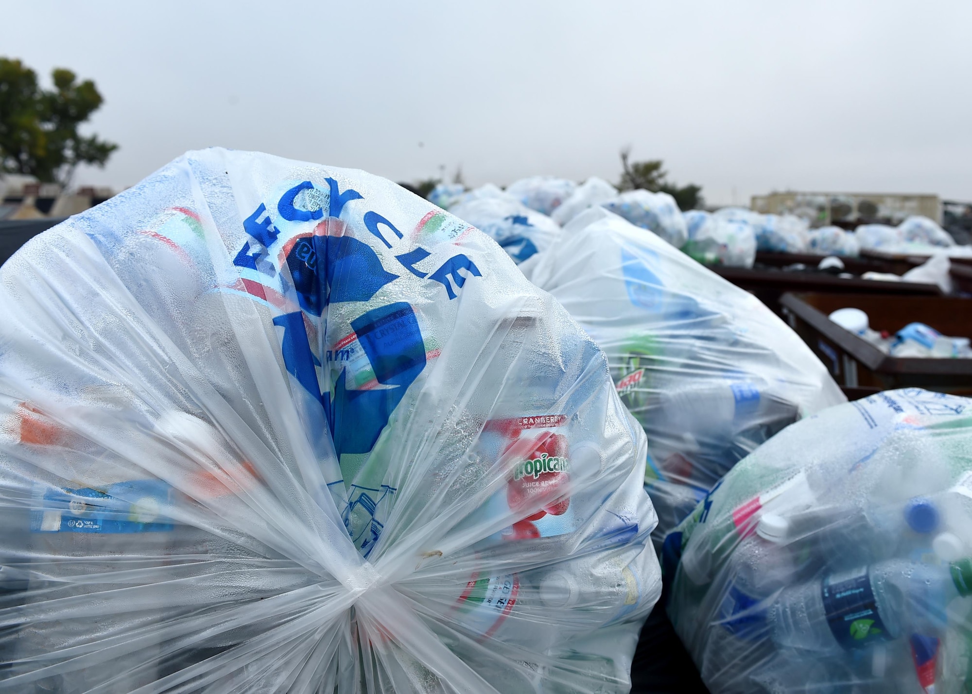 Bags full of plastic bottles sit at the Altus Air Force Base recycling center, Nov. 10, 2015. Recycling helps reduce the amount of natural resources being used for creating products such as paper, plastic and other materials that people use daily. (U.S. Air Force photo by Senior Airman Franklin R. Ramos/Released)