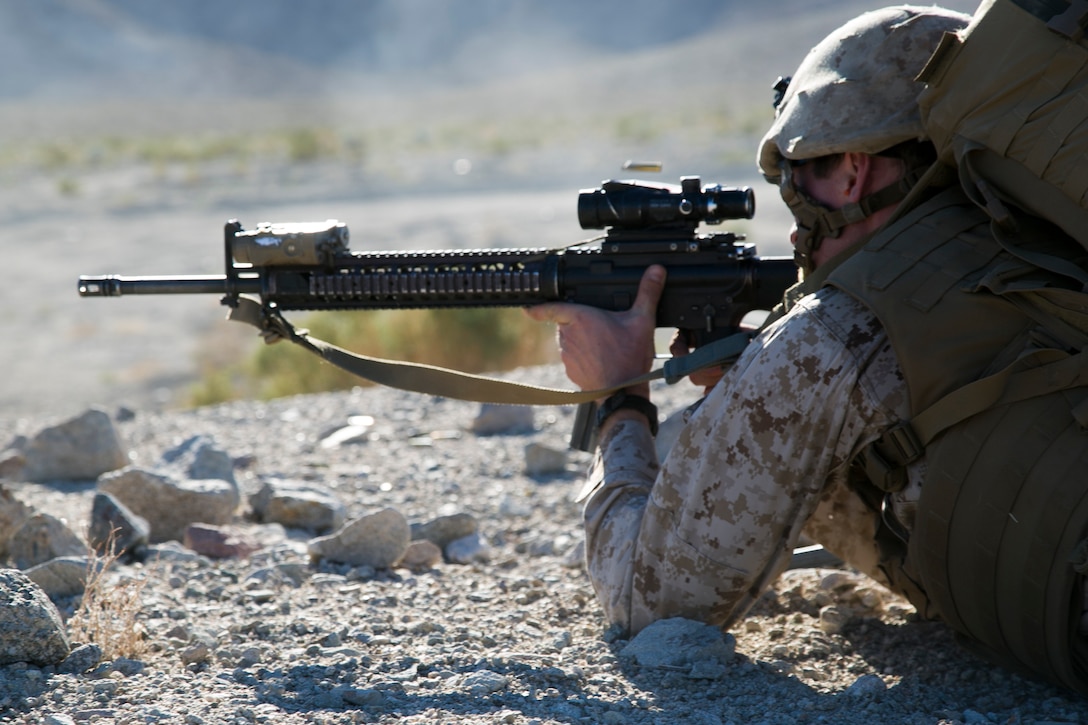 A Marine fires his weapon at an enemy target during a simulated raid of a hostile village during a composite exercise on Marine Corps Air Ground Combat Center Twentynine Plams, Calif., Oct. 30, 2015. U.S. Marine Corps photo by Cpl. Briauna Birl
