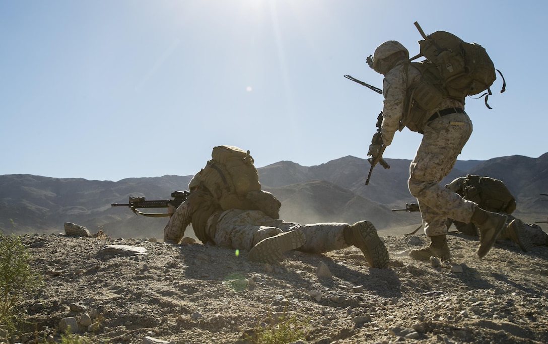 Marines move tactically toward enemy targets as they conduct a raid on a simulated hostile village during a composite exercise on Marine Corps Air Ground Combat Center Twentynine Palms, Calif., Oct. 30, 2015. U.S. Marine Corps photo by Cpl. Briauna Birl