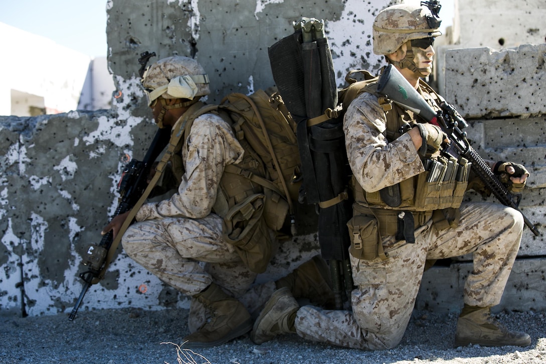 Marines provide security during a raid on a simulated hostile village during composite training on Marine Corps Air Ground Combat Center Twentynine Palms, Calif., Oct. 30, 2015. U.S. Marine Corps photo by Cpl. Briauna Birl