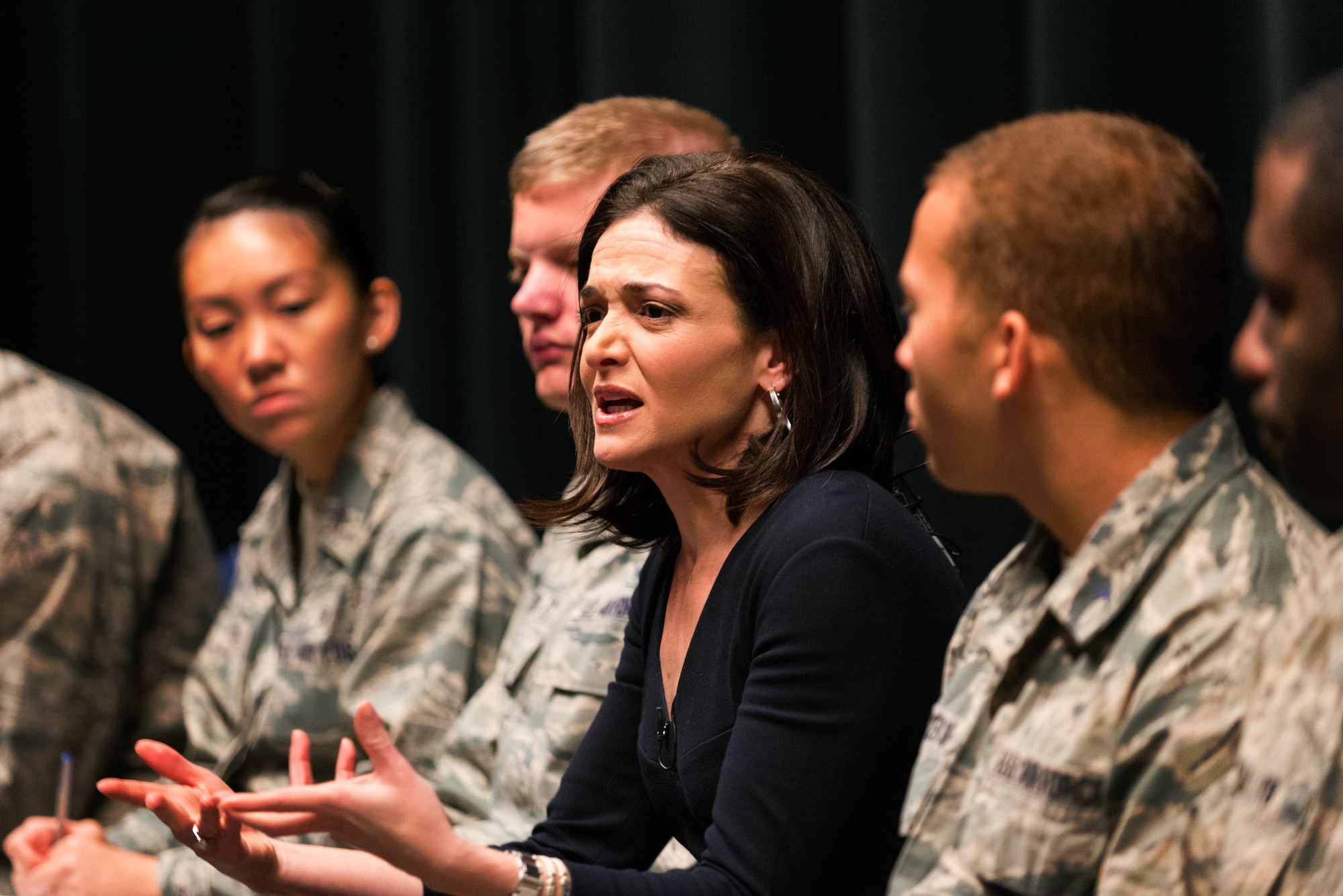 Sheryl Sandberg, the chief operating officer of Facebook, chats with cadets on the stage at Arnold Hall Nov. 6, 2015. Sandberg was at the Air Force Academy to discuss Lean-In Circles, a peer networking program she created that is being used by the Defense Department. (U.S. Air Force photo/Liz Copan)