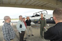 Lt. Col. Steve Dawson, 559th Flying Training Squadron director of operations, briefs San Antonio air traffic controllers on the T6A-Texan II aircraft during their tour at Joint Base San Antonio-Randolph Nov. 6, 2015. Air Traffic Controllers are responsible for directing aircraft safety, including keeping aircraft a safe distance apart, advises on landing and alerts pilots to potential problems. (U.S. Air Force photo by Joel Martinez/Released).