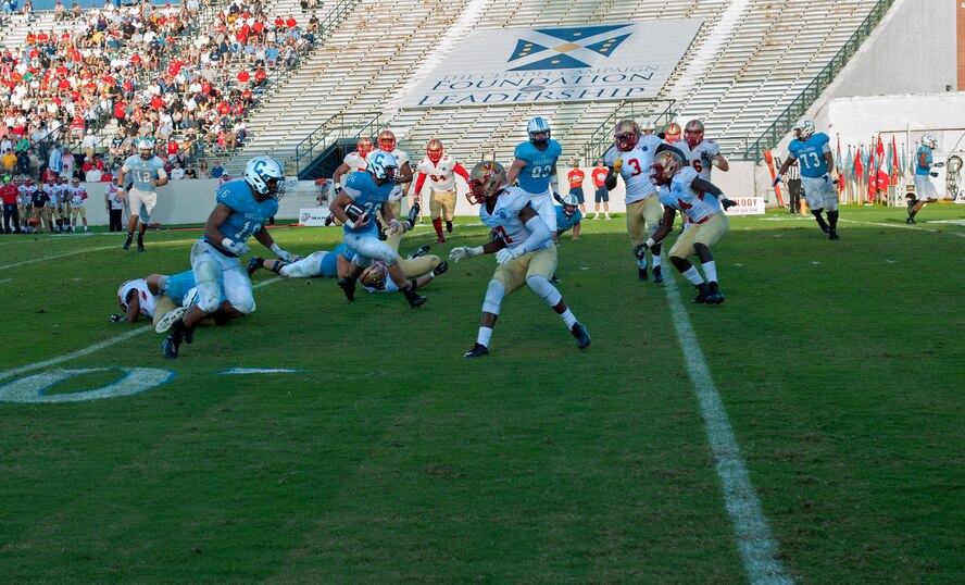 An Air Force Reserve aircrew consisting seven graduates of The Citadel flew over the Bulldogs Homecoming Military Classic of the South game against the Virginia Military Institute Keydets in Charleston, S.C. Nov. 7. The 701st Airlift Squadron “Turtles” flight crew performed the flyover of Johnson Hagood Stadium in a Joint Base Charleston C-17 Globemaster III as part of a local training mission. (U.S. Air Force photo by Staff Sgt. Bobby Pilch)
