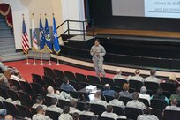 Tech. Sgt. Stephanie West, Joint Base San Antonio Master Resiliency Trainer, addresses the audience during Wingman Resiliency Day Nov. 6, 2015 at Joint Base San Antonio-Randolph. Members of the 502nd Air Base Wing at JBSA-Randolph broke from daily operations and missions to reinforce the Wingman concept and provide a foundation for building resilient Airmen with team building exercises in the form of a sporting, recreational, and process improvement events. (U.S. Air Force photo by Melissa Peterson)