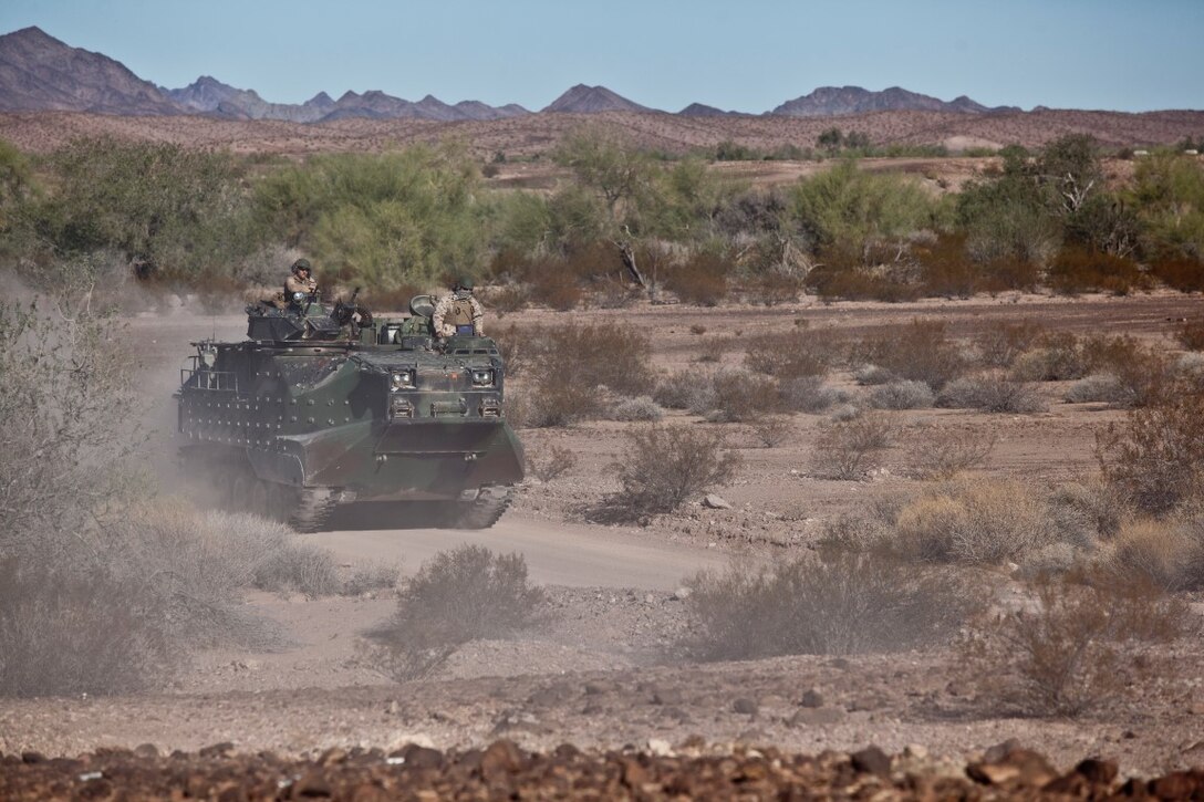 U.S. 1st Marine Division, Alpha Company, 3D Amphibious Assault Battalion conducts their Amphibious Assault Vehicle qualifications tables 1-9 for the first time at Yuma Proving Grounds, Ariz., on Nov. 7, 2015.  Alpha Company is conducting this training in preparation for future deployments. (U.S. Marine Corps photo taken by LCpl. AaronJames B. Vinculado/Released)