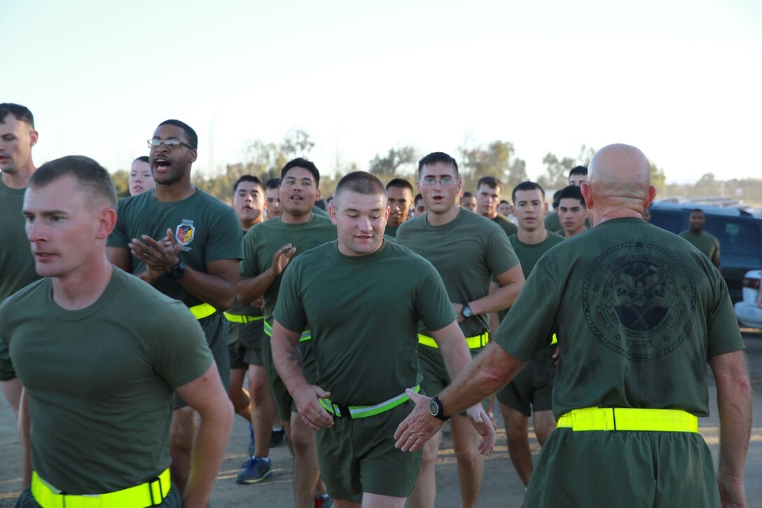 Lieutenant General David H. Berger (right), Commanding General, I Marine Expeditionary Force, congratulates the Marines of I MEF Headquarters Group as they finish a motivational run celebrating the 240th birthday of the Marine Corps aboard Marine Corps Base Camp Pendleton, Calif., Nov. 6, 2015. The motivational run is a I MHG tradition that commences the morning of the Marine Corps ball and serves to reaffirm every Marine’s sense of honor, courage and commitment. More than 1,000 Marines and Sailors participated in the run.