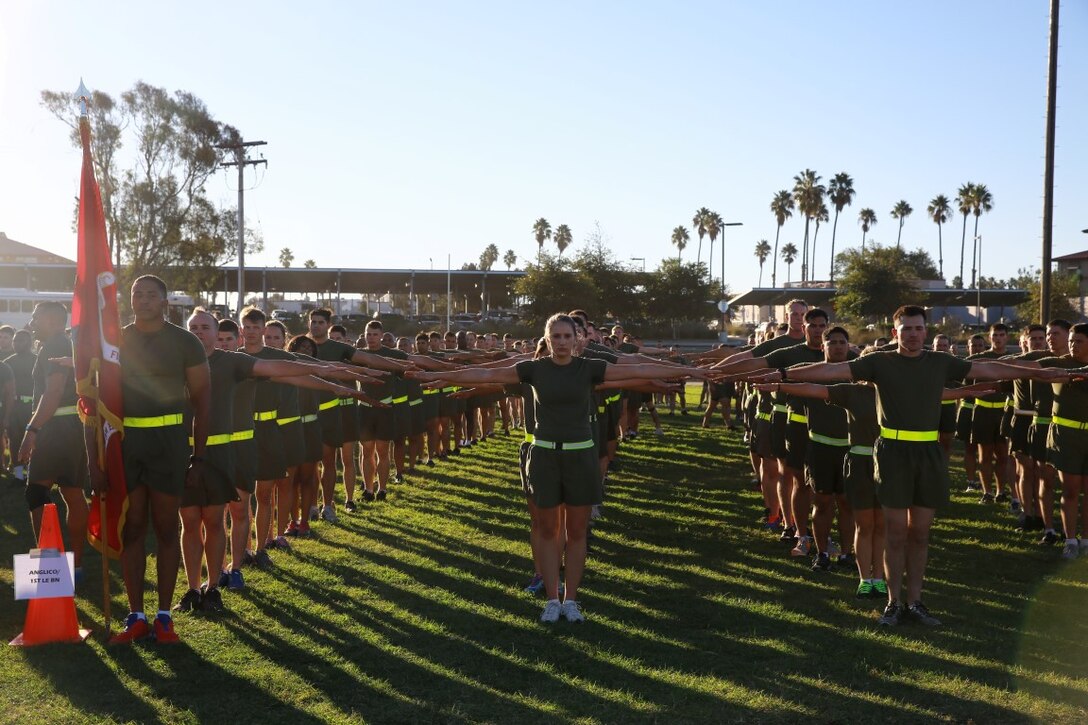 Marines with I Marine Expeditionary Force Headquarters Group stretch in formation after completing a motivational run celebrating the 240th birthday of the Marine Corps aboard Marine Corps Base Camp Pendleton, Calif., Nov. 6, 2015. The motivational run is a I MHG tradition that commences the morning of the Marine Corps ball and serves to reaffirm every Marine’s sense of honor, courage and commitment More than 1,000 Marines and Sailors participated in the run.