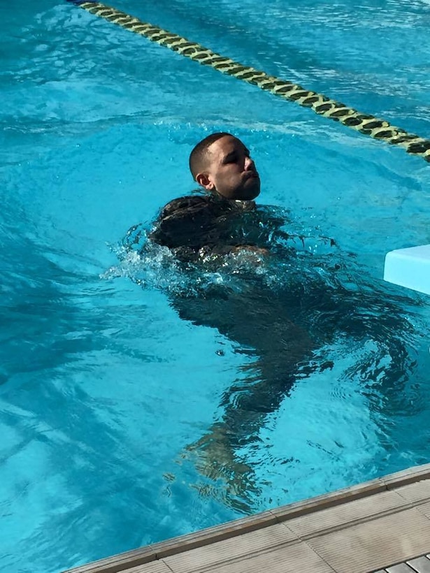 Sgt. Christian Vega from the 398th Finance Detachment, executes the 100-meter swim event during the German Armed Force Proficiency Badge (GAFPB) Competition at Ponce, Puerto Rico.