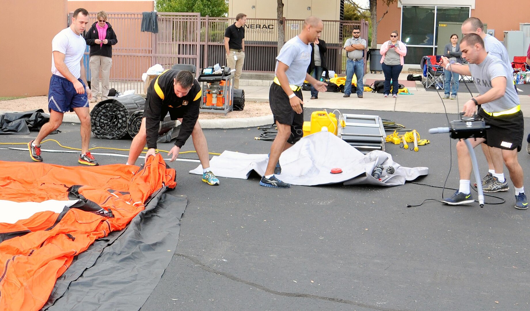 The San Antonio Military Medical Center decontamination team springs into action to assemble a portable decontamination tent during the Decon Rodeo Oct. 29 hosted by the Emergency Medical Service/Hospital Disaster Group Decon-Radiation Safety Officer Committee and the Southwest Texas Regional Advisory Council for Trauma.