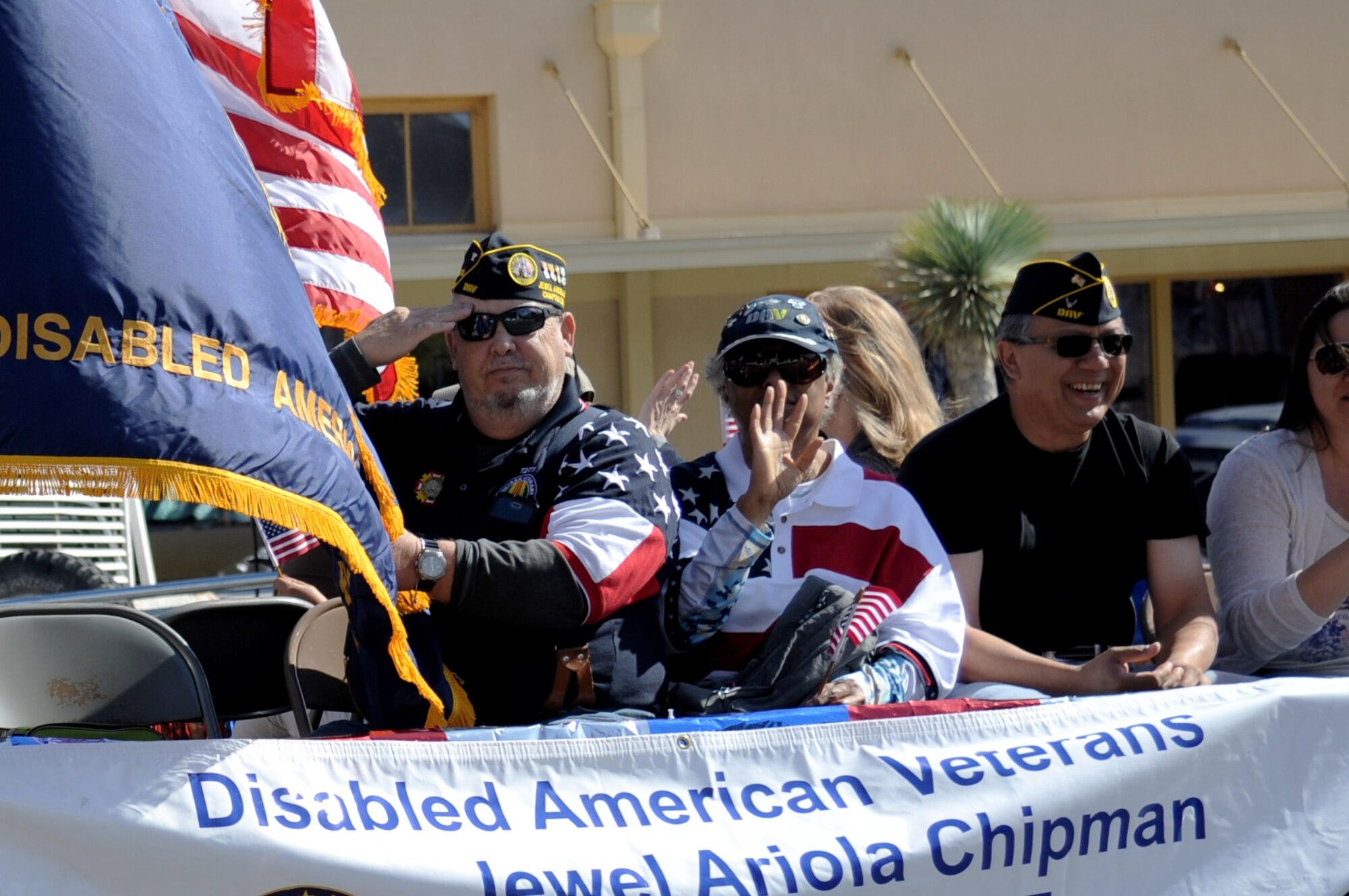 San Angelo Jewel Ariola Chipman Disabled American Veterans wave and salute to spectators at the Veterans Day Parade in San Angelo, Texas, Nov. 7, 2015. The parade featured veterans, current enlisted, marching bands and more. (U.S. Air Force photo by Senior Airman Joshua Edwards/Released)