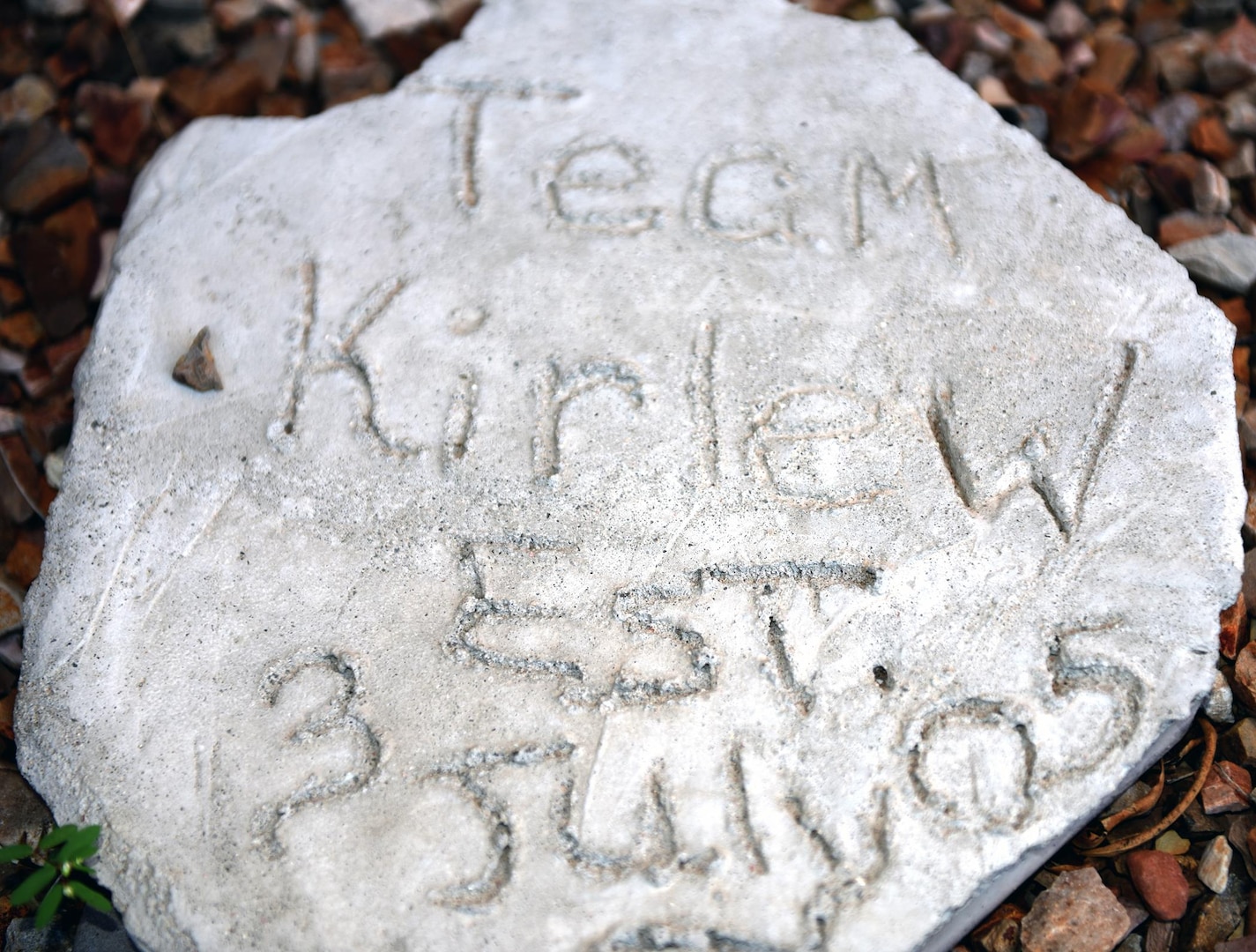 The Kirlew family motto, “Team Kirlew” etched on stone, just outside the entrance to the family’s home, serves a reminder to the family they are in the fight against cancer together.