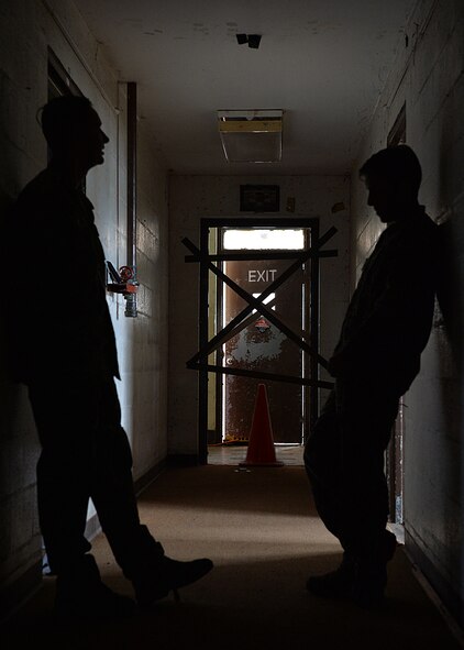 Tech. Sgt. Jeffrey Langley and Master Sgt. Phoebus Lazarids, joint tactical air controllers from the 25th Air Support Operations Squadron, discuss the final planning details of a field training exercise on Bellows Air Force Station, Hawaii, Oct. 20, 2015. The FTX was a combined training opportunity for Airmen from the 25th ASOS and Soldiers from the 25th Infantry Division to train together and interact as they would in a deployed location. The training allows military members to deploy to field locations to conduct tactical operations under simulated combat conditions.(U.S. Air Force photo by Tech. Sgt. Aaron Oelrich/Released)