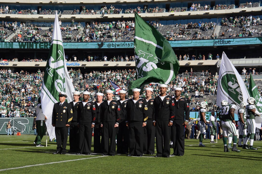 Sailors assigned to Navy Recruiting District New York stand in formation at MetLife Stadium during a Veterans Day military appreciation football game where the New York Jets hosted the Jacksonville Jaguars in East Rutherford, N.J., Nov 8, 2015. U.S. Navy photo by Petty Officer 1st Class Carlos M. Vazquez II
