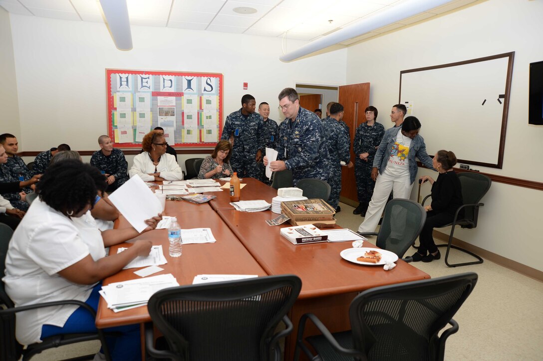 Sailors and civilian personnel gather to celebrate and honor Fran Quinn, health benefits advisor, Naval Branch Health Clinic Albany for her 55 years of federal service in a ceremony. Quinn has spent the last 48 years of her extensive civil service career at NBHC Albany. The event was held at the clinic aboard Marine Corps Logistics Base Albany, Nov. 4.