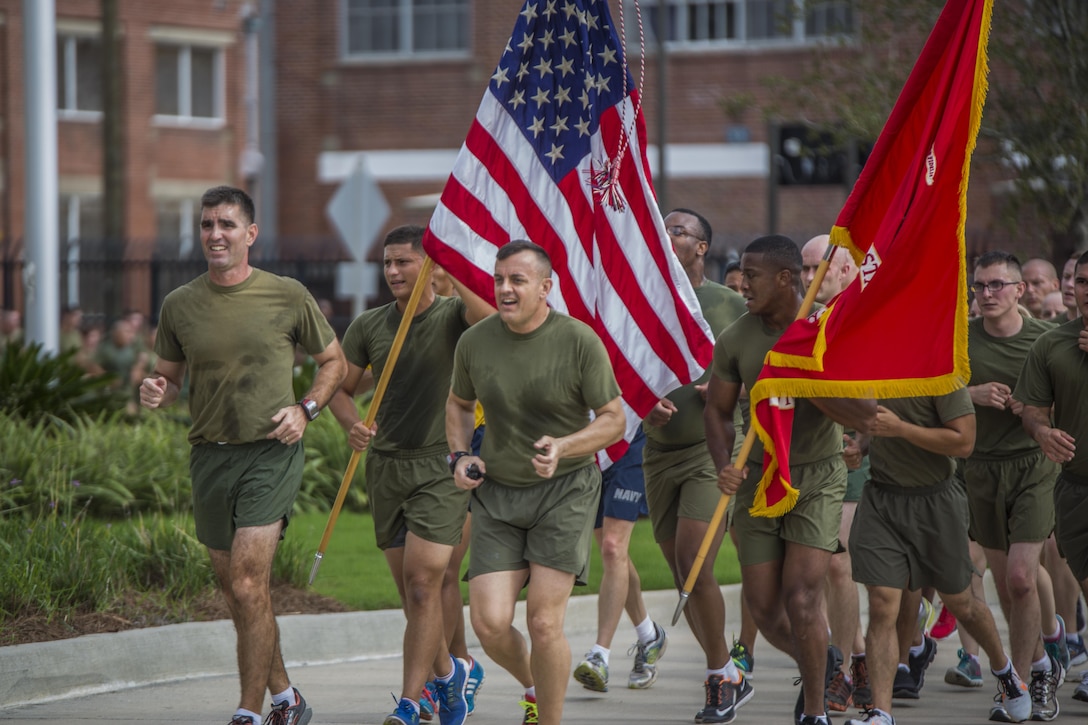 Marines from Marine Forces Reserve return from a 3-mile motivational formation run led by Sgt. Maj. Michael J. Rowan (center) and Col. Steven G. Godinho at Marine Corps Support Facility, New Orleans, Nov. 10, 2015. Each year, the Marines celebrate the Corps’ birthday with a cake-cutting ceremony followed by a run. Since Nov. 10, 1775, the United States Marine Corps has garnered the reputation as the world's most efficient amphibious fighting force, engaging in combat on battlefronts across the globe since its inception. 