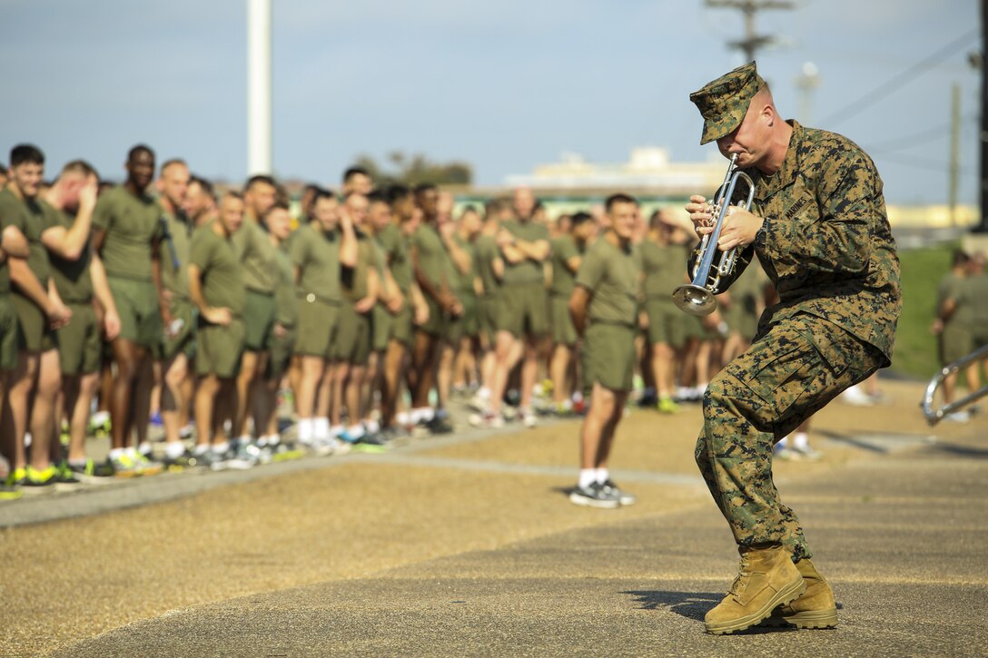 Cpl. Jordan Gardner, a trumpet player with Marine Corps Band New Orleans, plays a solo for the Marines of Marine Forces Reserve during their motivational run through Algiers Point, La., Nov. 10, 2015. The Marines completed a 3-mile formation run through the neighborhood, after the traditional cake-cutting ceremony in honor of the Marine Corps’ 240th birthday. Since Nov. 10, 1775, the United States Marine Corps has garnered the reputation as the world’s most efficient amphibious fighting force, engaging in combat on battlefronts across the globe since its inception. 