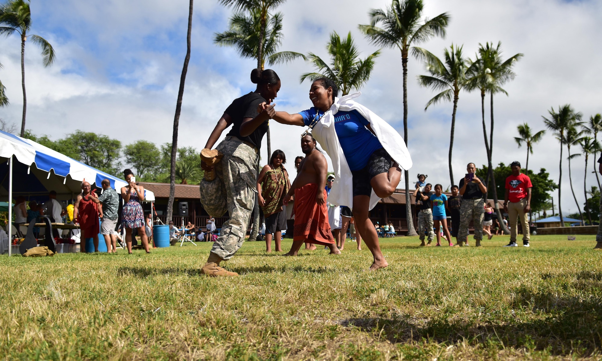 Kapuaikaula Makahiki event-goers participate in hakamoa, a one-legged wrestling competition during JBPHH's annual Makahiki event, held Nov. 7, 2015, at Hickam Harbor Beach on Joint Base Pearl Harbor-Hickam. The Makahiki, known as a "Hawaiian Thanksgiving," provided an opportunity for military families to appreciate and learn more about the culture and history of Hawaii. (U.S. Air Force photo by Staff Sgt. Christopher Stoltz/Released)
