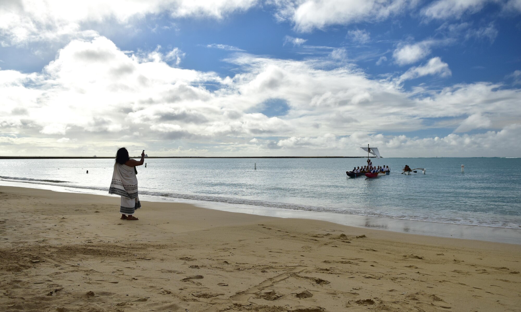 Canoes carrying Lono, a representation of the ancient Hawaiian diety Lono, or god of Makahiki, are invited ashore at Hickam Beach during JBPHH's annual Makahiki event, held Nov. 7, 2015, at Hickam Harbor Beach on Joint Base Pearl Harbor-Hickam. The Makahiki, known as a "Hawaiian Thanksgiving," provided an opportunity for military families to appreciate and learn more about the culture and history of Hawaii. (U.S. Air Force photo by Staff Sgt. Christopher Stoltz/Released)

