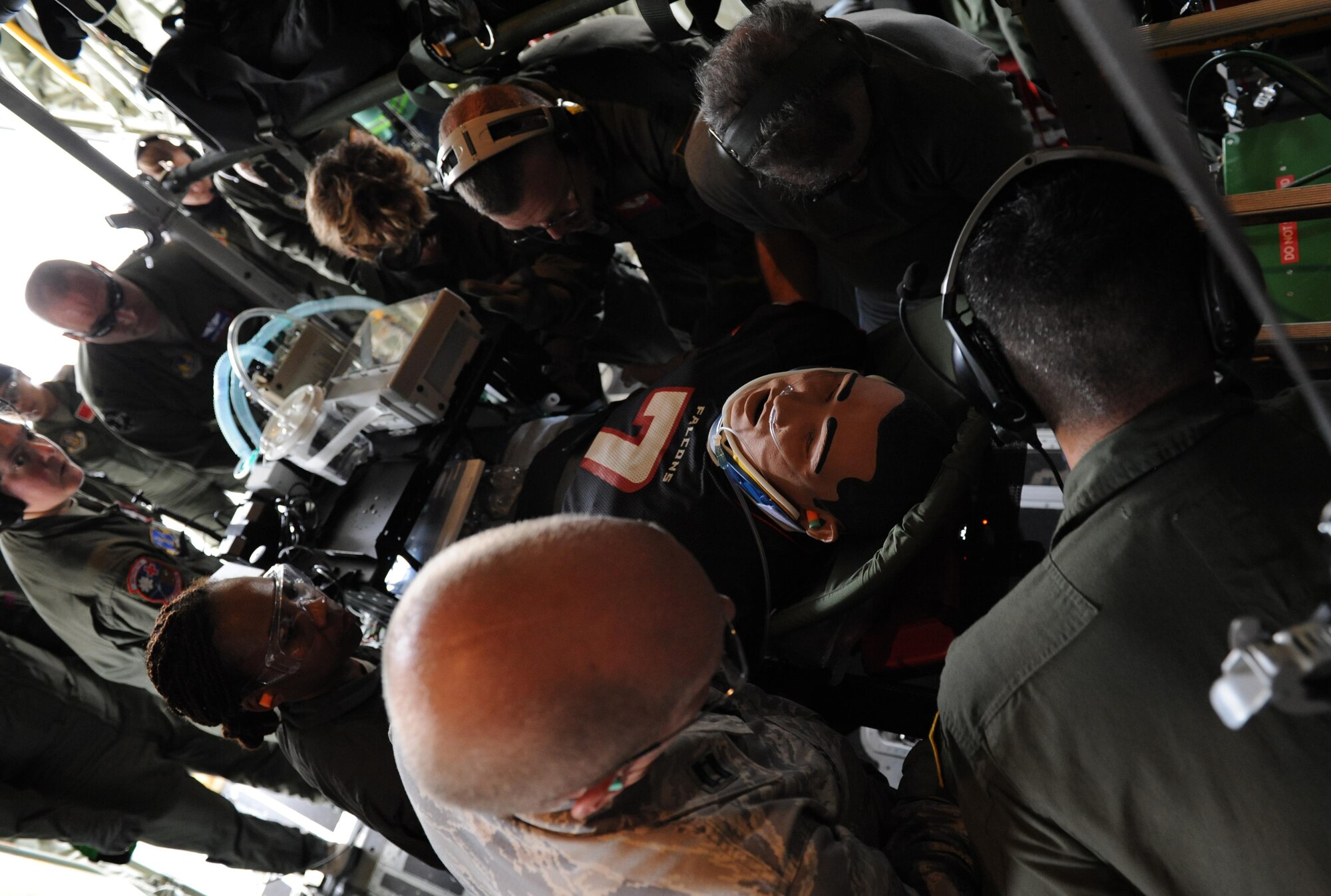 Members of the 81st Aerospace Medicine Squadron, Keesler Air Force Base, Miss., assist the Critical Care Air Transport Team with loading a patient aboard a C-130J aircraft during the National Guard’s annual Southern Strike training at Stennis International Airport Nov. 5, 2015, Miss. Members of the 81st Medical Group assisted with aircraft engine running on- and off-loading. The two-week joint international combat exercise was hosted by the Mississippi National Guard and included service members from both active and reserve components in every branch of the U.S. military service. (U.S. Air Force photo by Kemberly Groue)