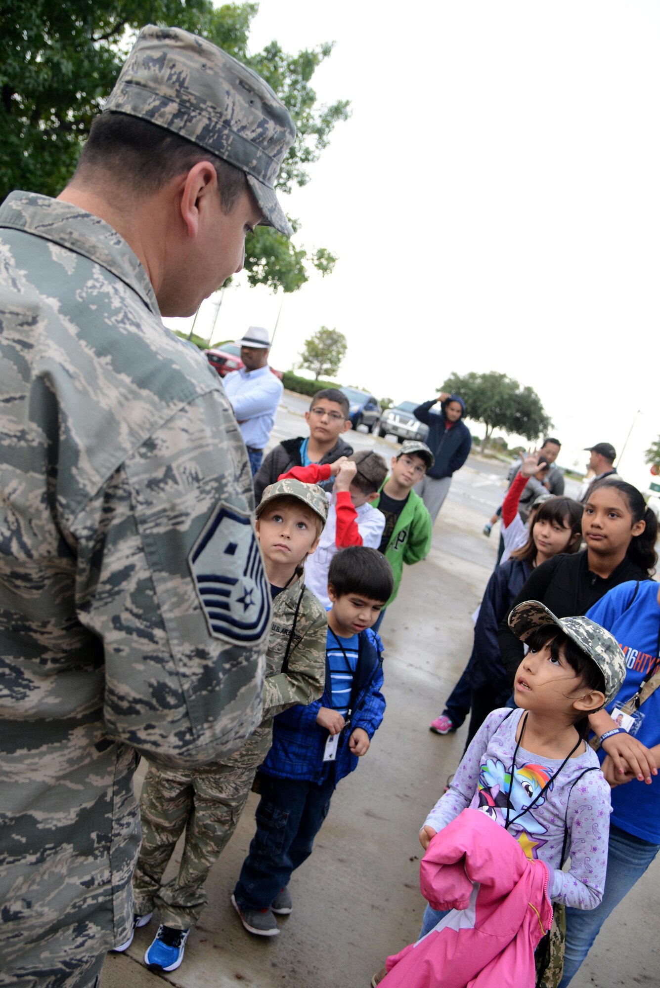Master Sgt. Abraham Avila, 47th Mission Support Group first sergeant, gives a briefing to military and local children on Laughlin Air Force Base, Texas, Nov. 7, 2015. Military members volunteered to man the deployment line, which simulated an out-processing system much like the one used by military members in preparation for real-world deployments. (U.S. Air Force photo by Airman 1st Class Ariel D. Partlow)