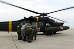 U.S. Air Force and Army medical personnel participated in a medical evacuation exercise as a part of the VIGILANT ACE 16 peninsula wide exercise at Kunsan Air Base, Republic of Korea, Nov. 5, 2015. The medical evacuation exercise, or medevac, tested the 8th Medical Groups ability to safely and quickly get injured personnel the help they need through air transportation provided by the Army. 