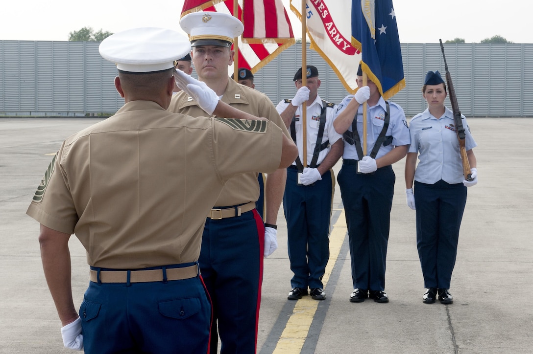 U.S. Marine Master Sgt. Jayson Franco renders a salute to U.S. Marine Capt. Gregory Lynch signifying the transfer of custody of the color guard during a repatriation ceremony at Subang Air Base, Malaysia, Nov. 5, 2015. The ceremony was executed to honor the return of one of our fallen service members who paid the ultimate sacrifice when his plane went down over Malaysia in 1945. Franco is assigned to the Defense POW/MIA Accounting Agency as the NCOIC of the Asian Pacific research section and Lynch is a DPAA team leader. The two were part of a 15-member joint U.S. military team, comprised of members of the Defense POW/MIA Accounting Agency as well service members from Untied States Army Pacific Command and Pacific Air Force Command, that was sent from Hawaii to honor the remains of a fallen service member who paid the ultimate sacrifice when his plane went down over Malaysia in 1945. The mission of the Defense POW/MIA Accounting Agency is to provide the fullest possible accounting for our missing personnel to their families and the nation. (U.S. Air Force photo by Staff Sgt. Brian J. Valencia)