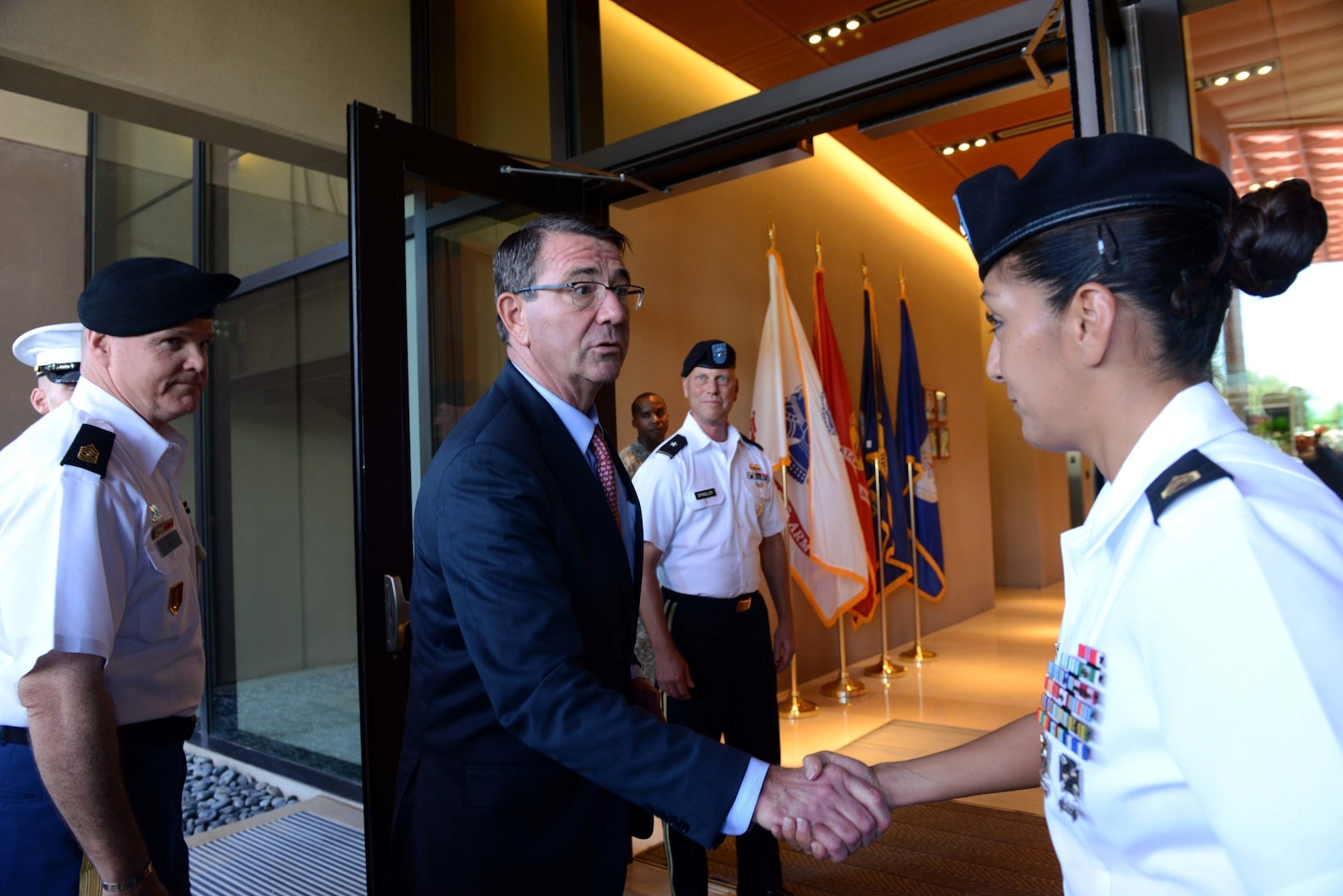 Secretary of Defense Ash Carter greets U.S. Army Staff Sgt. Claudia Smallman, Defense POW/MIA Accounting Agency recovery noncommissioned officer.  While at DPAA, he spoke with service members about the importance of the agency's joint mission in the Indo-Asia Pacific region. The mission of the Defense POW/MIA Accounting Agency is to provide the fullest possible accounting for our missing personnel to their families and the nation. (U.S. Air Force photo by Staff Sgt. La'Shanette Garrett)