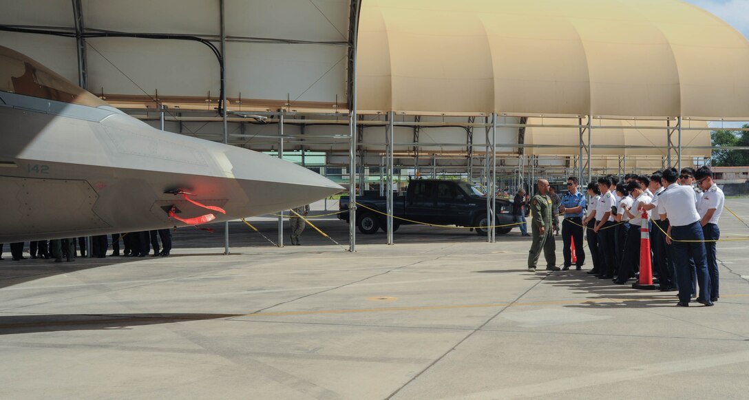 U.S. Air Force Lt. Col. Phillip Mallory, Hawaiian Raptors pilot, talks with Republic of Korea Air Force Academy cadets, Nov. 10, 2015, Joint Base Pearl Harbor-Hickam, Hawaii. The cadet's visit was part of an effort to build a foundation of partnership and interoperability between Headquarters Pacific Air Forces and future ROKAF leaders. (U.S. Air Force photo by Tech. Sgt. Amanda Dick/Released)