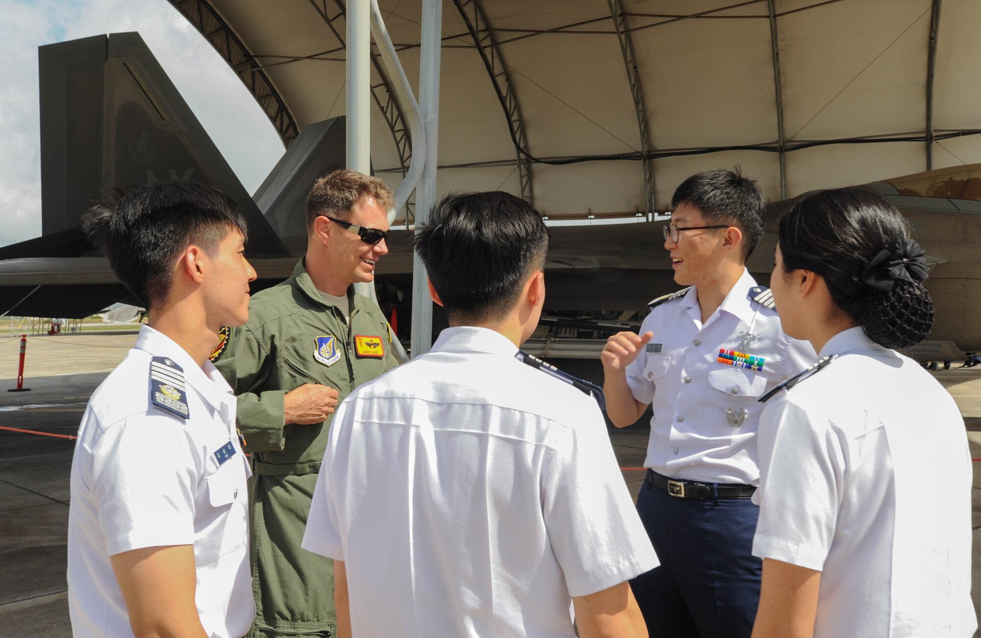 U.S. Air Force Lt. Col. James Sage, Hawaiian Raptors pilot, discusses U.S. Air Force F-22 Raptor capabilities with Republic of Korea Air Force Academy cadets, Nov. 10, 2015, Joint Base Pearl Harbor-Hickam, Hawaii. The cadets’ visit was part of an effort to build a foundation of partnership and interoperability between Headquarters Pacific Air Forces and future ROKAF leaders. (U.S. Air Force photo by Tech. Sgt. Amanda Dick/Released)