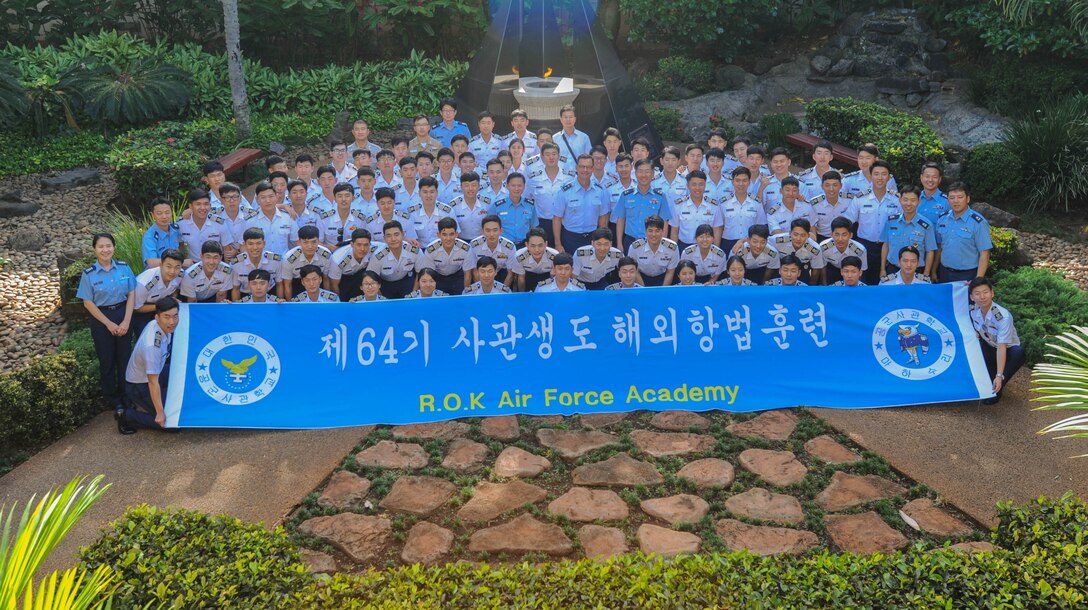 Republic of Korea Air Force Academy cadets take a photo with U.S. Air Force Maj. Gen. Mark Dillon, Pacific Air Forces vice commander, Nov. 10, 2015, Joint Base Pearl Harbor-Hickam, Hawaii. The cadet's visit was part of an effort to build a foundation of partnership and interoperability between Headquarters Pacific Air Forces and future ROKAF leaders. (U.S. Air Force photo by Tech. Sgt. Amanda Dick/Released)