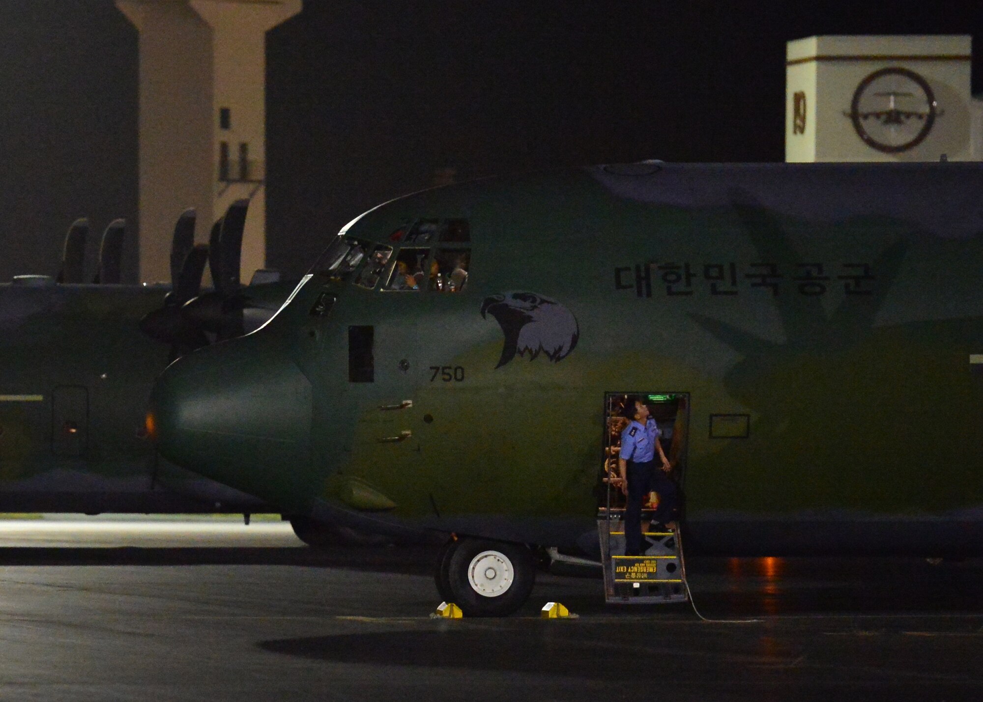 A member of the Republic of Korea Air Force exits a ROKAF C-130 shortly after landing on Joint Base Pearl Harbor-Hickam, Hawaii, Nov. 10, 2015. This is the first ever visit by the ROKAF academy cadets to Hawaii. This visit is designed to strengthen the alliance between the U.S. and ROK’s future leaders. (U.S. Air Force photo by Tech. Sgt. Aaron Oelrich/Released)