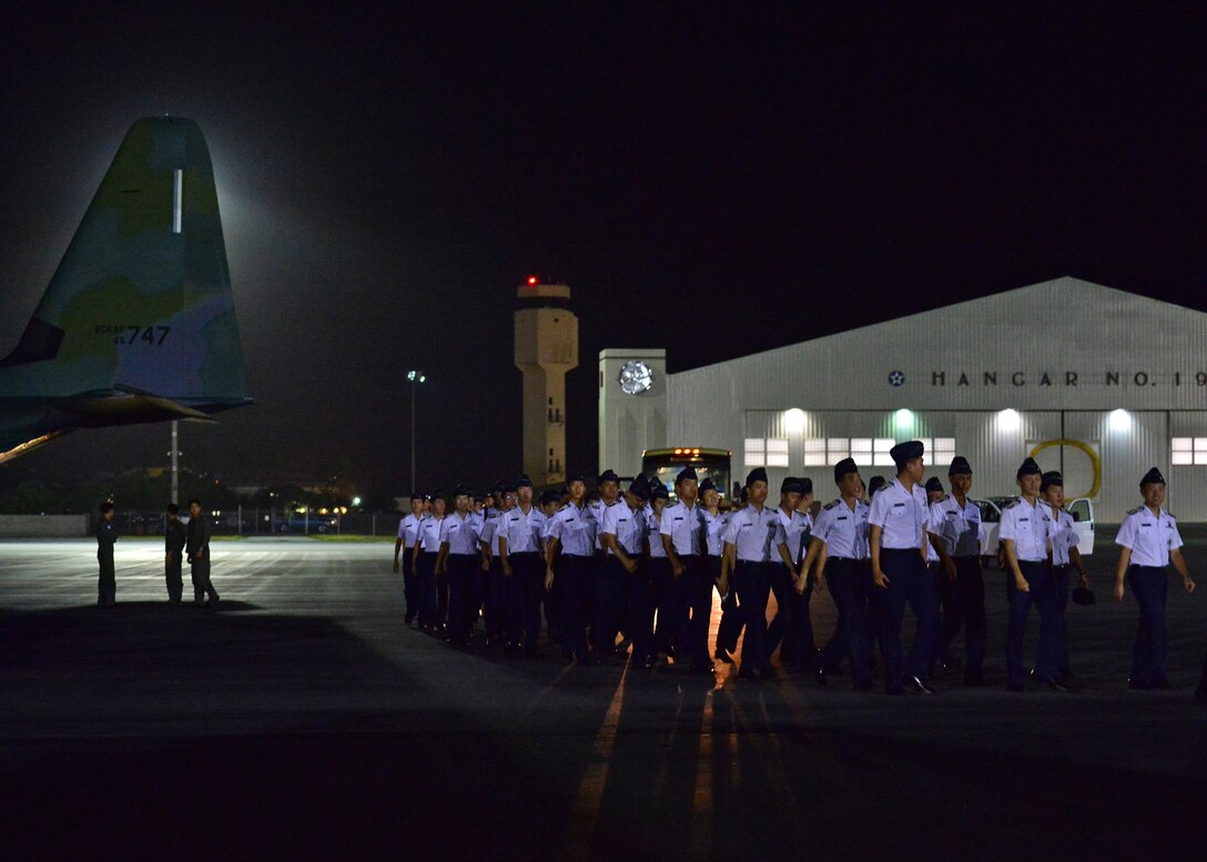 Republic of Korea Air Force Academy Cadets walk across the tarmac shortly after landing on Joint Base Pearl Harbor-Hickam, Hawaii, Nov. 10, 2015. This is the first ever visit by the ROKAF academy cadets to Hawaii. This visit is designed to strengthen the alliance between the U.S. and ROK’s future leaders. (U.S. Air Force photo by Tech. Sgt. Aaron Oelrich/Released)