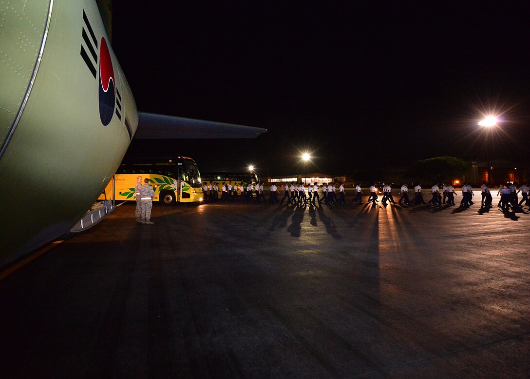 Republic of Korea Air Force Academy Cadets walk across the tarmac shortly after landing on Joint Base Pearl Harbor-Hickam, Hawaii, Nov. 10, 2015. This is the first ever visit by the ROKAF academy cadets to Hawaii. This visit is designed to strengthen the alliance between the U.S. and ROK’s future leaders. (U.S. Air Force photo by Tech. Sgt. Aaron Oelrich/Released)