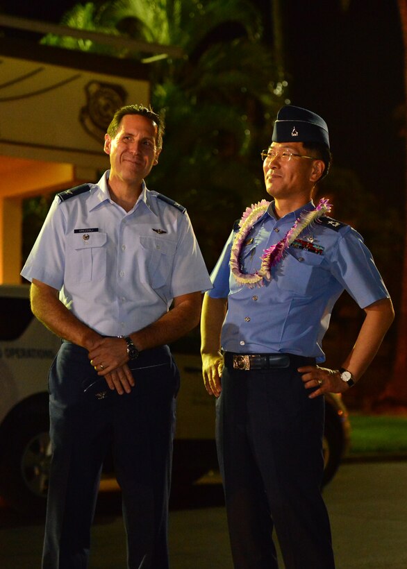 Col. Ronni Orezzoli, Pacific Air Force deputy director strategic plans and programs, (left) and Brig. Gen. Dongkyu Lee, Republic of Korea Air Force Academy commandant, watch as Republic of Korea Air Force Academy Cadets arrive on Joint Base Pearl Harbor-Hickam, Hawaii, Nov. 10, 2015.  This is the first ever visit by the ROKAF academy cadets to Hawaii. This visit is designed to strengthen the alliance between the U.S. and ROK’s future leaders. (U.S. Air Force photo by Tech. Sgt. Aaron Oelrich/Released)  