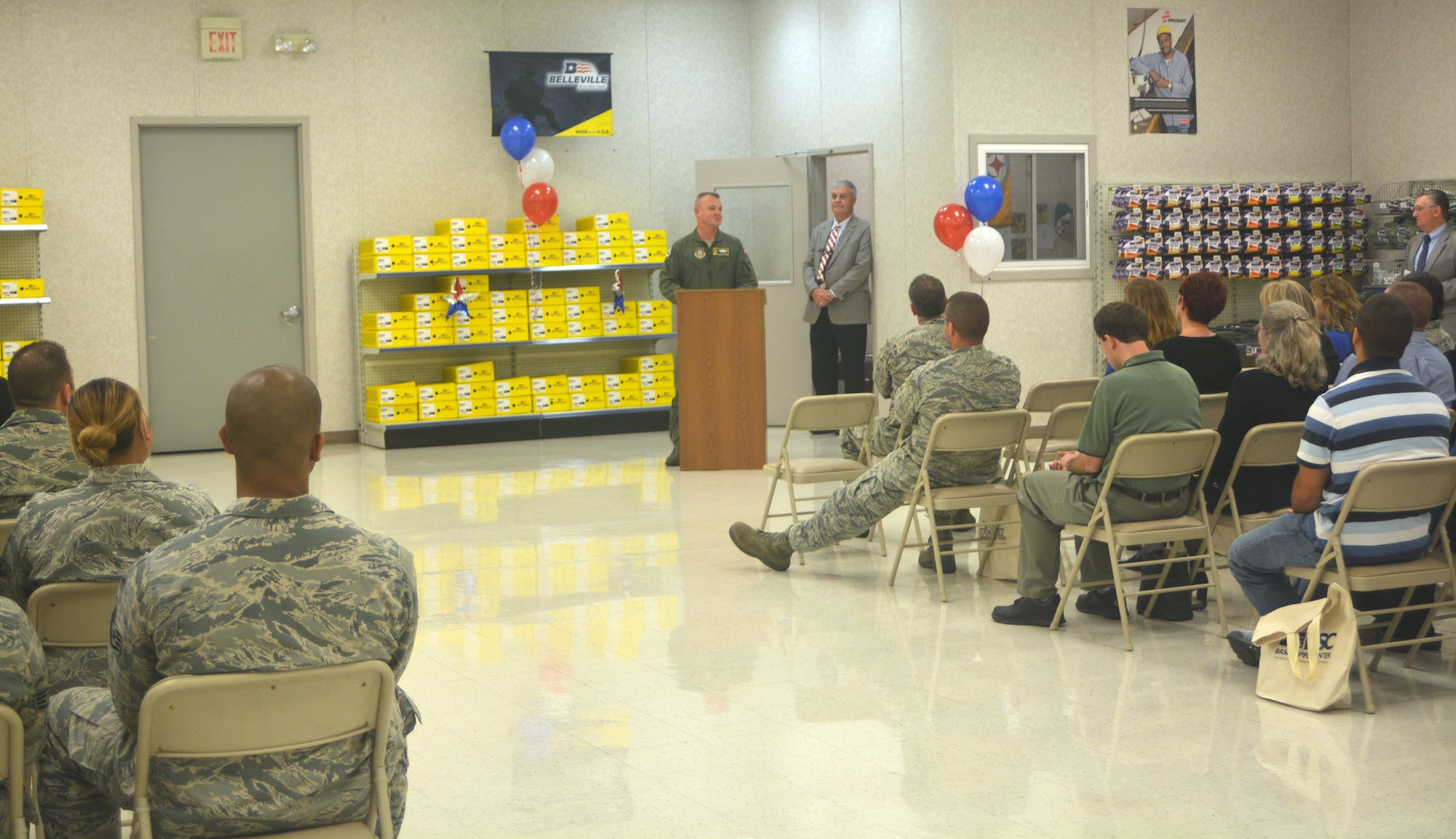 Col. Scott Durham, 512th Airlift Wing commander, addresses the crowd as part of the 20th anniversary celebration of the Dover Air Force Base Ability One Base Supply Center Nov. 3, 2015, on Dover AFB, Del. The ceremony featured guest speakers, recognition presentations and refreshments. (U.S. Air Force photo/Master Sgt. Veronica Aceveda)
