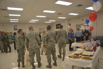 Team Dover members gathered at the Dover Air Force Base Ability One Base Supply Center Nov. 3, 2015, for a 20th anniversary celebration. The Dover AFB, Del., location was the first of eight Blind Industries and Services of Maryland owned and operated facilities, which provides employment opportunities for blind and low vision people. (U.S. Air Force photo/Master Sgt. Veronica Aceveda)