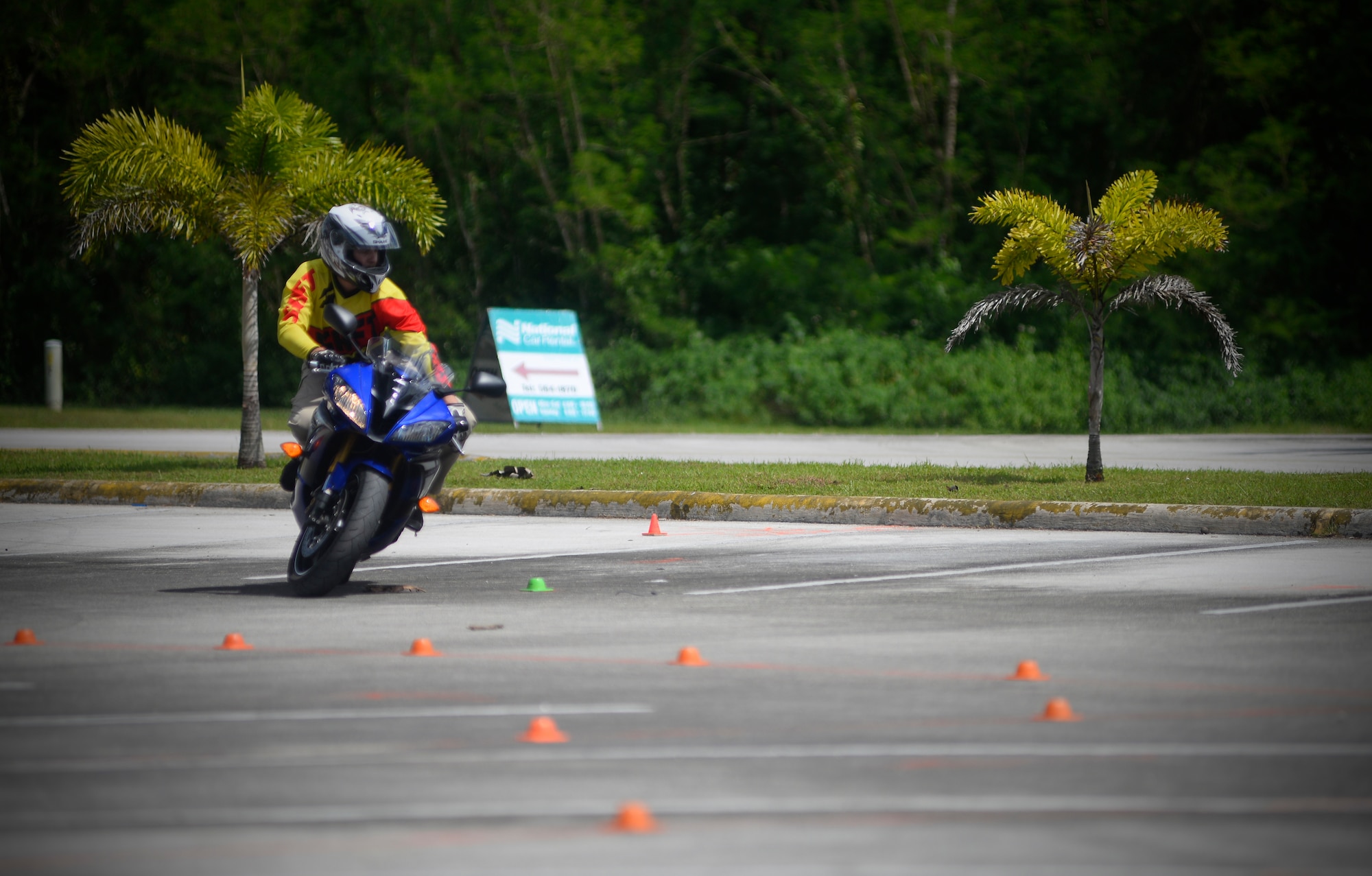 A rider navigates an advanced-difficulty motorcycle skills course Nov. 6, 2015, at Naval Base Guam. Service members reviewed and encouraged safe riding practices during a motorcycle mentorship event, which included a group ride from Andersen Air Force Base to Apra Harbor. (U.S. Air Force photo by Staff Sgt. Alexander W. Riedel/Released)