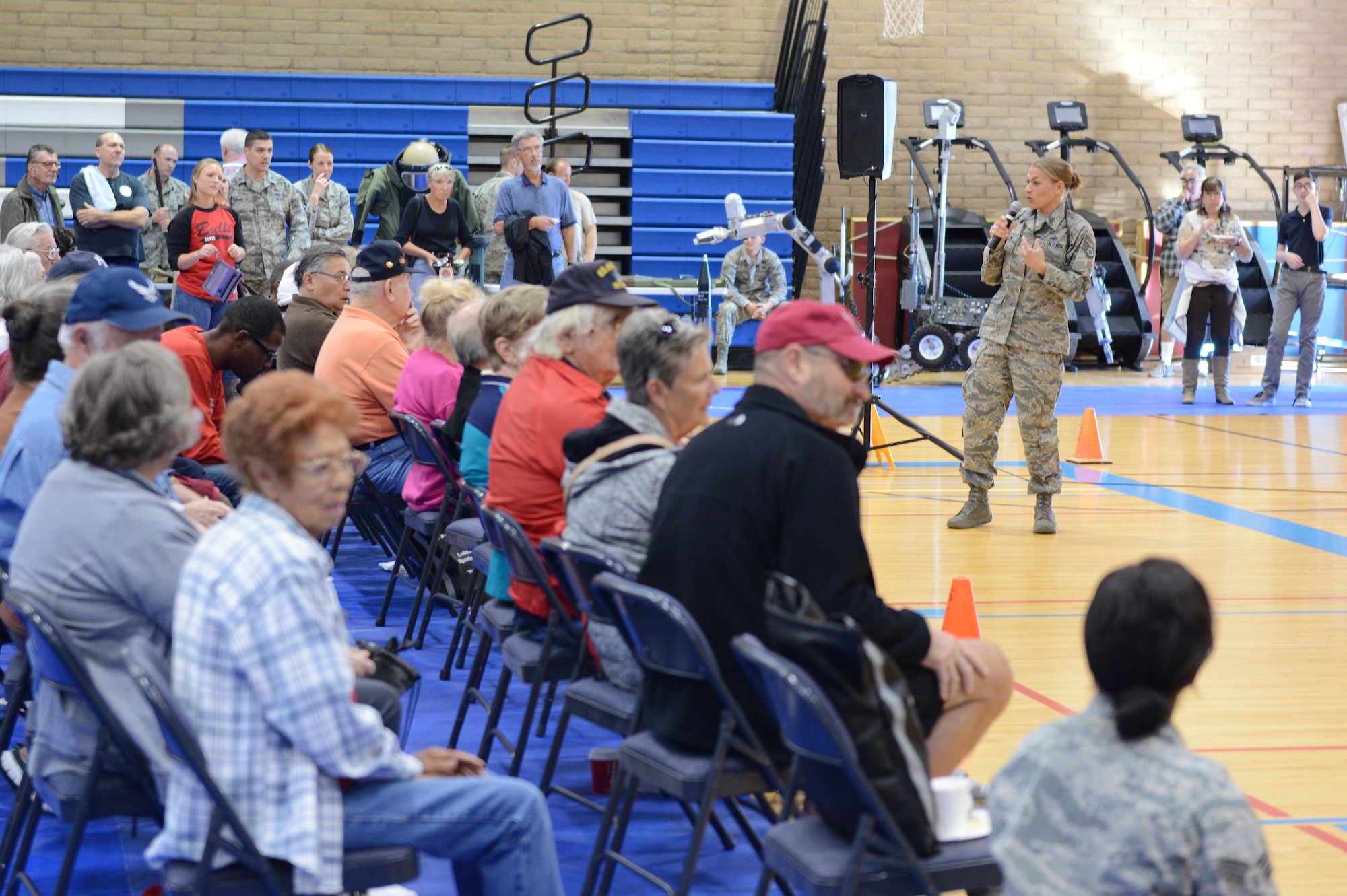 Staff Sgt. Jessica Keller, 56th Security Forces Squadron military working dog handler, speaks to retirees about the training MWD handlers do with their dogs during Retiree Appreciation Day at Luke Air Force Base, Arizona, Nov. 7, 2015. (U.S. Air Force photo by Senior Airman James Hensley)