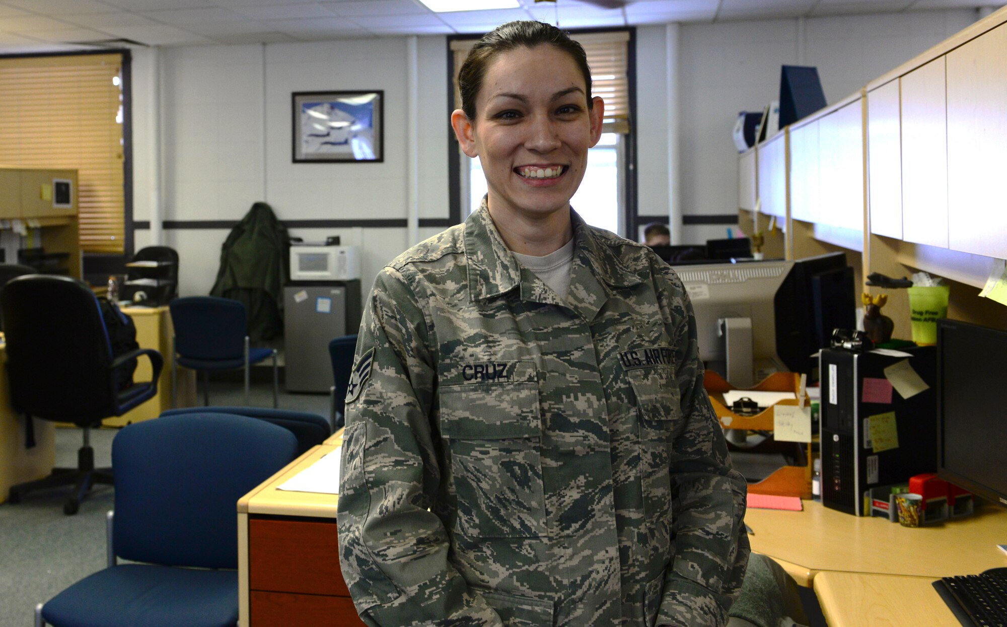 U.S. Air Force Senior Airman Tiffinie Cruz, a 354th Comptroller Squadron budget analyst and separation technician, takes a quick break Nov. 9, 2015, at Eielson Air Force Base, Alaska. Cruz recently moved to customer service and said she looks forward to assisting Air Force members with separations and retirements. (U.S. Air Force photo by Airman 1st Class Cassandra Whitman/Released)