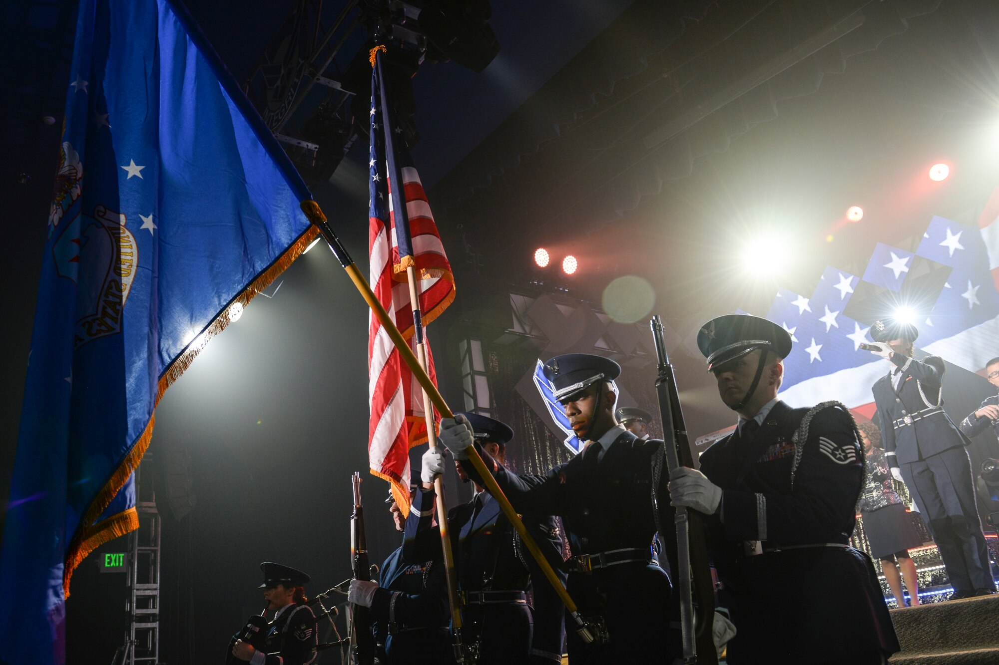 Members of Tops in Blue present the Colors during a show Nov. 6, 2015, in the Ernie Walker Theater at Eielson Air Force Base, Alaska. Tops in Blue serves as an expeditionary entertainment unit to provide quality entertainment from within Air Force resources for the Air Force family. (U.S. Air Force photo by Staff Sgt. Joshua Turner/Released)