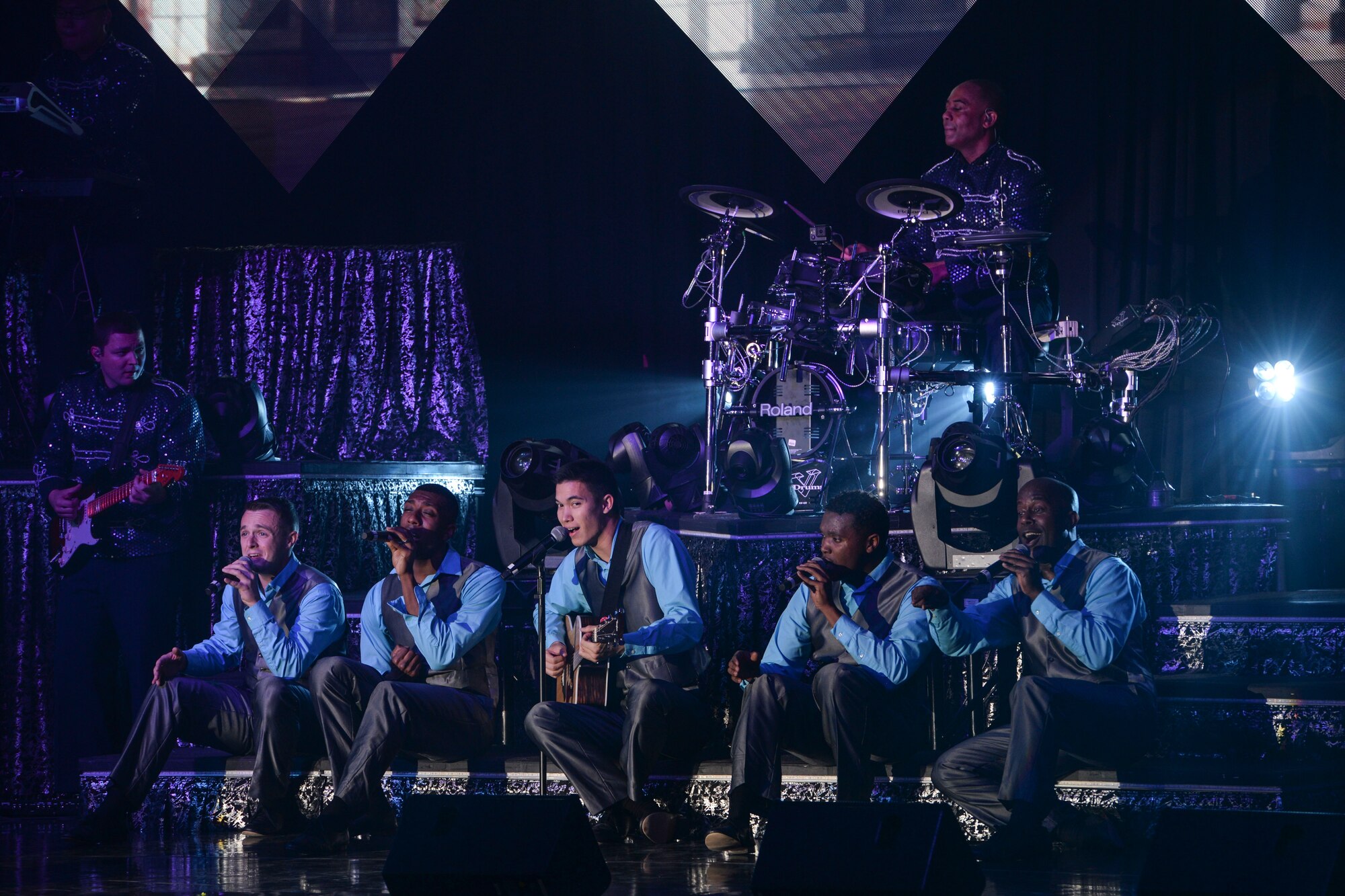Members of Tops in Blue perform during a show Nov. 6, 2015, in the Ernie Walker Theater at Eielson Air Force Base, Alaska. Tops in Blue serves as an expeditionary entertainment unit to provide quality entertainment from within Air Force resources for the Air Force family. (U.S. Air Force photo by Staff Sgt. Joshua Turner/Released)
