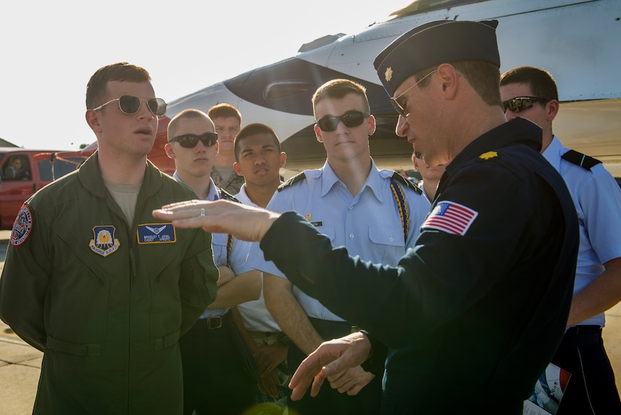 Maj. Alexander Goldfein, U.S. Air Force Thunderbirds right wing pilot, explains the capabilities of an F-16 Fighting Falcon to cadets from a local college, Nov. 6, 2015, at Moody Air Force Base, Ga.  The aircraft is capable of travelling at speeds over 1,500 miles per hour and its rate of climb is 30,000 feet per minute. (U.S. Air Force photo by Airman 1st Class Greg Nash/Released)