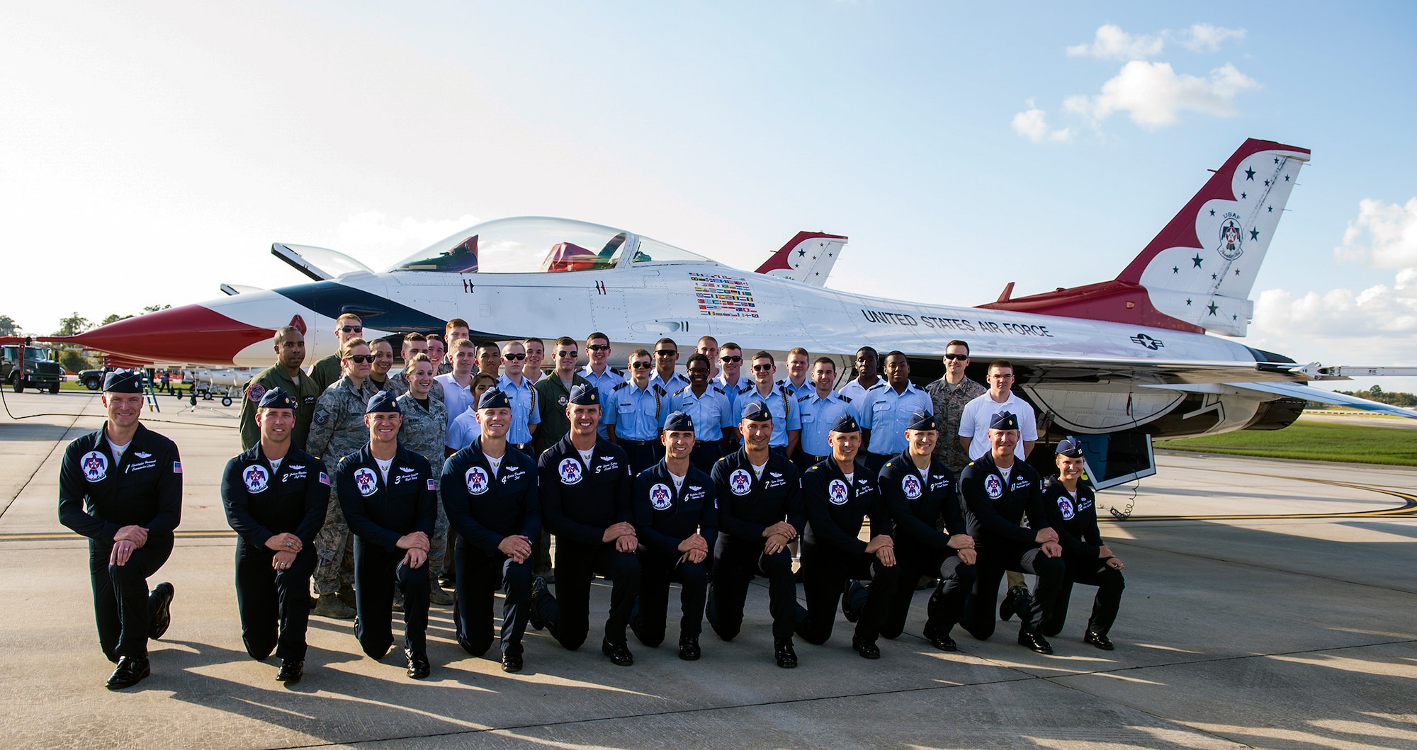U.S. Air Force Thunderbirds and Detachment 172 Air Force Reserve Officers’ Training Corps members pose for a photo during a meet and greet Nov. 6, 2015, at Moody Air Force Base, Ga. Over 20 cadets from a local college received the opportunity to see the Thunderbirds aircrew perform precise aerial maneuvers and talk about various Air Force opportunities. (U.S. Air Force photo by Airman 1st Class Greg Nash/Released)