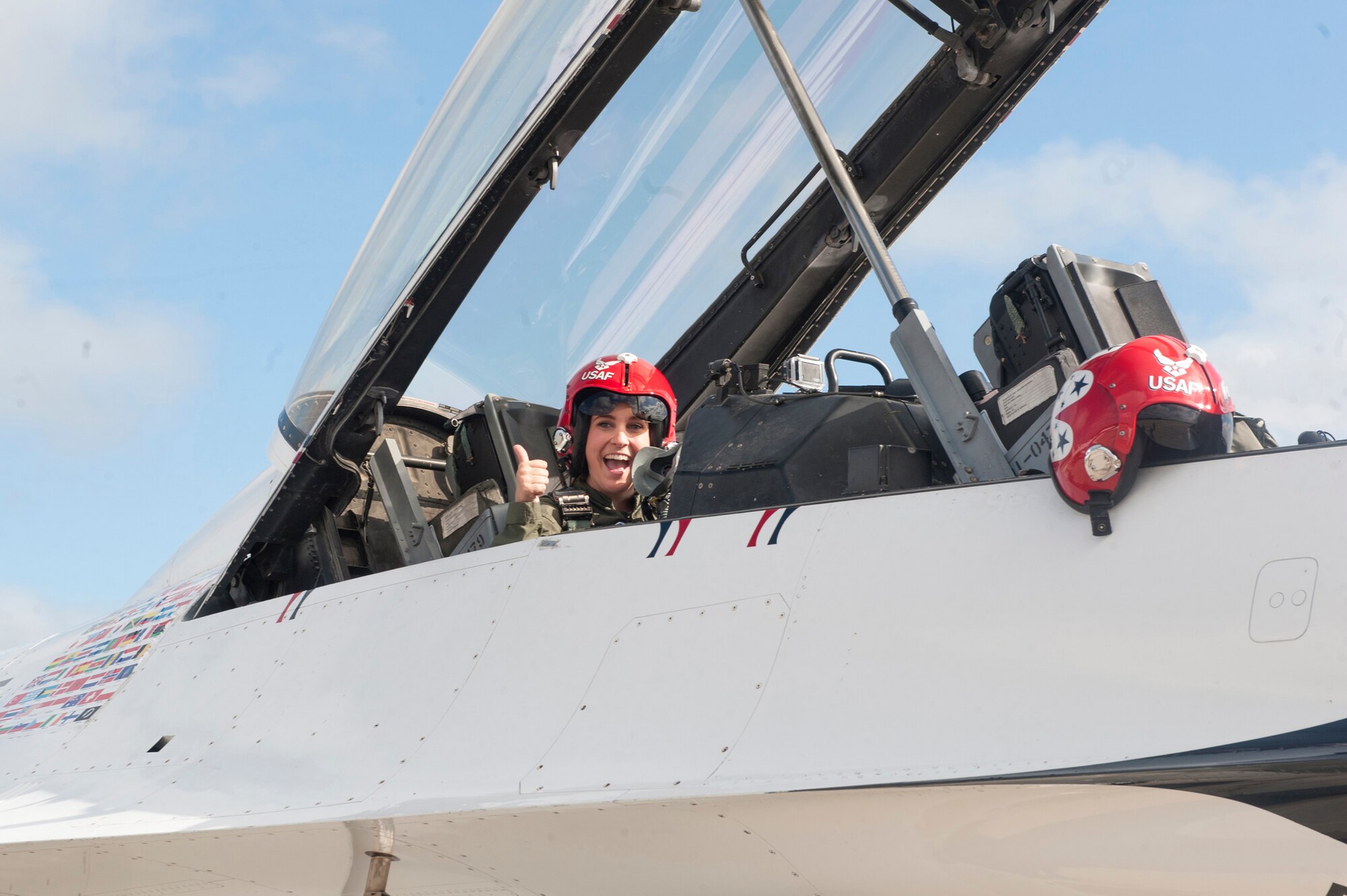 Caitlyn Chastain, a local news reporter, sits in the cockpit of an F-16D Fighting Falcon, Nov. 6, 2015, at Moody Air Force Base, Ga. The U.S. Air Force Thunderbirds gave Chastain the opportunity to fly as part of a U.S. Air Force Thunderbirds Flight Demonstration Team media flight during Moody’s Open House weekend. (U.S. Air Force Airman 1st Class Kathleen D. Bryant/Released)