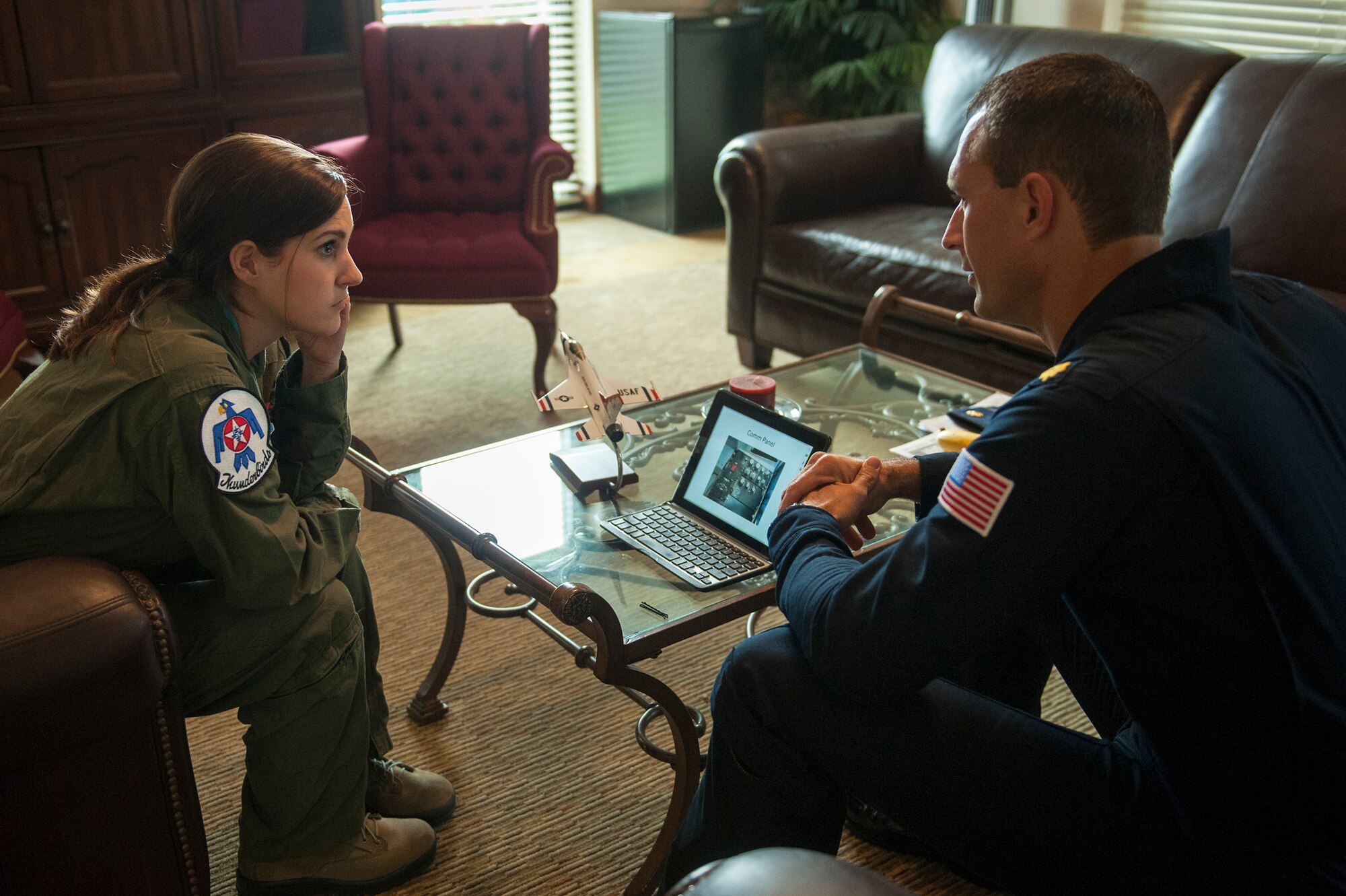Maj. Tyler Ellison, U.S. Air Force Thunderbirds operations officer, briefs Caitlyn Chastain, a local news reporter, on their flight, Nov. 6, 2015, at Moody Air Force Base, Ga. Chastain learned how to breathe properly during certain maneuvers, communicate with the pilot and what to do in an emergency situation. (U.S. Air Force Airman 1st Class Kathleen D. Bryant/Released)
