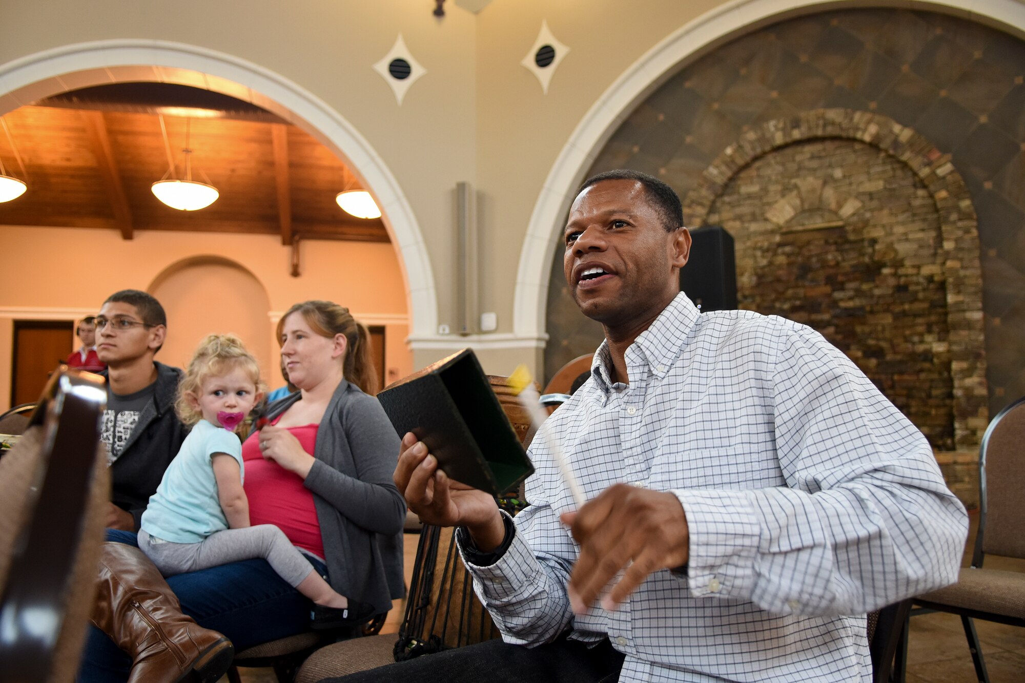 Army Sgt. 1st Class Derek Morgan, Company B 1-252 readiness NCO, plays an instrument during the USO of North Carolina Warrior Reset retreat, Nov. 4, 2015, at the Cape Fear Botanical Garden in Fayetteville, North Carolina. Service members and their families participated in music therapy, demonstrating that while individuals are unique, they can come together to make a strong team. (U.S. Air Force photo/Senior Airman Aaron J. Jenne)