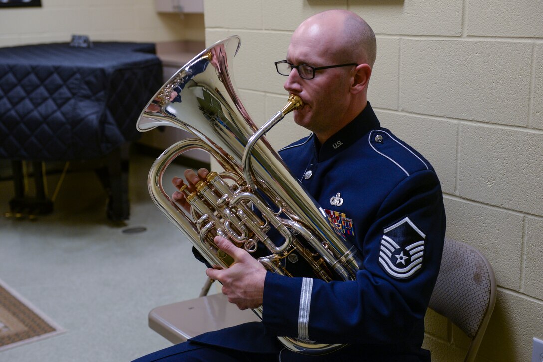 Master Sgt. Matthew Dunsmore, U.S. Air Force Heritage of America Band NCO in charge of marketing outreach, warms up before a performance at the Paramount Theater, Nov. 5, 2015, in Goldsboro, North Carolina. The Brass Ensemble played for hundreds of local community members as part of their tour from Pennsylvania to South Carolina. (U.S. Air Force photo/Airman 1st Class Ashley Williamson)